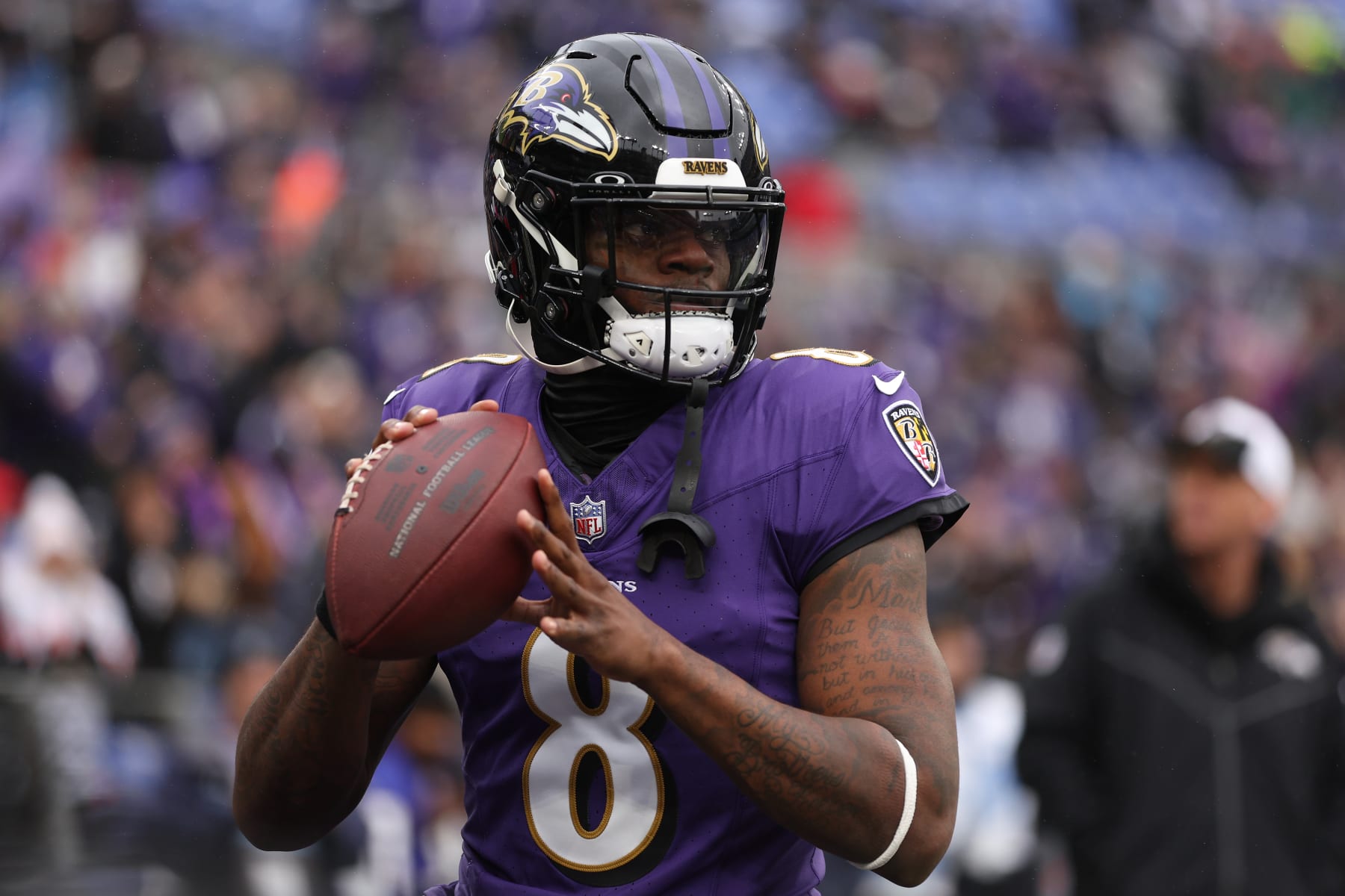BALTIMORE, MARYLAND - JANUARY 28: Lamar Jackson #8 of the Baltimore Ravens warms up prior to the AFC Championship Game against the Kansas City Chiefs at M&T Bank Stadium on January 28, 2024 in Baltimore, Maryland. (Photo by Patrick Smith/Getty Images)