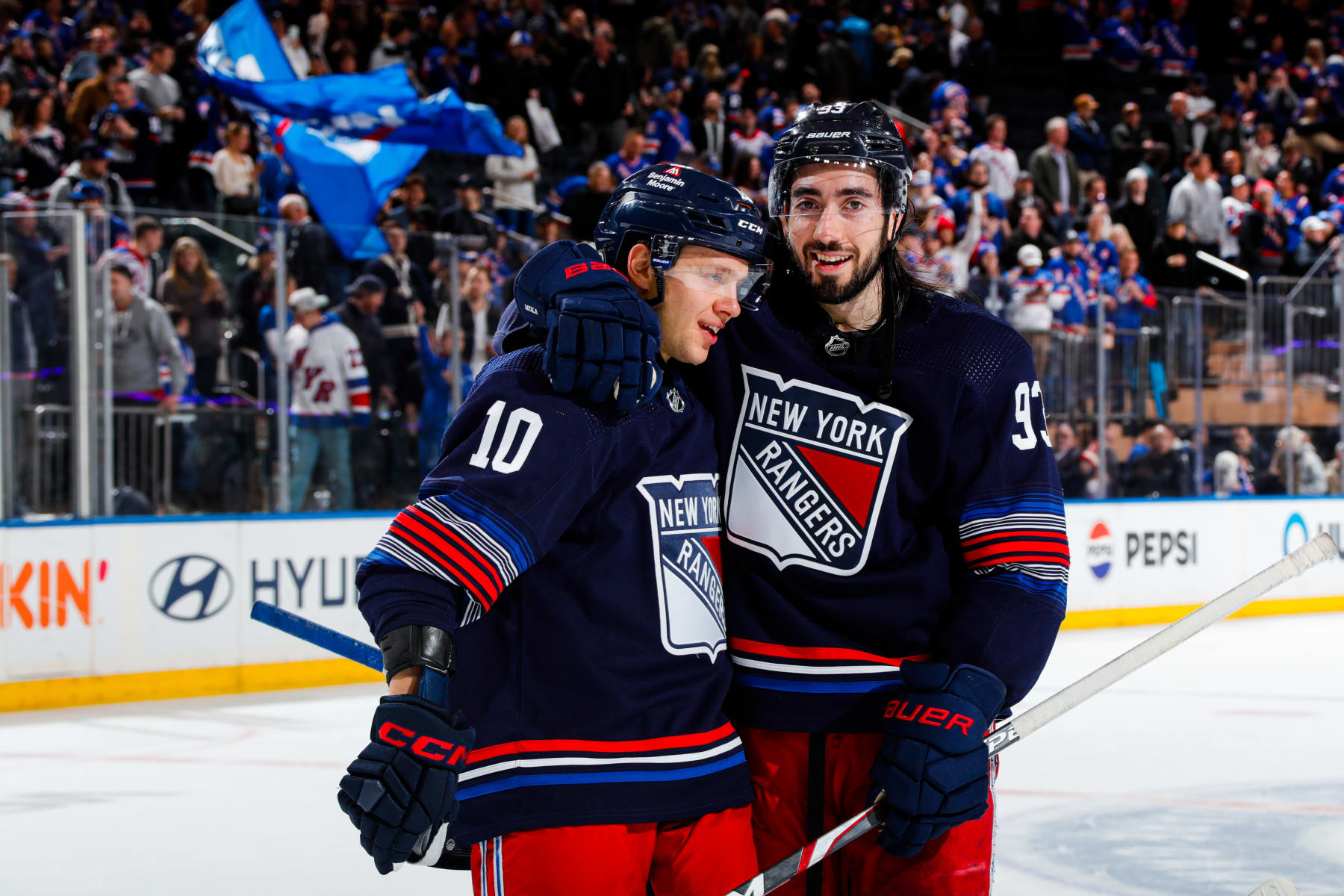 NEW YORK, NEW YORK - MARCH 23:  Mika Zibanejad #93 and Artemi Panarin #10 of the New York Rangers celebrate a 4-3 shootout win against the Florida Panthers at Madison Square Garden on March 23, 2024 in New York City. (Photo by Jared Silber/NHLI via Getty Images)