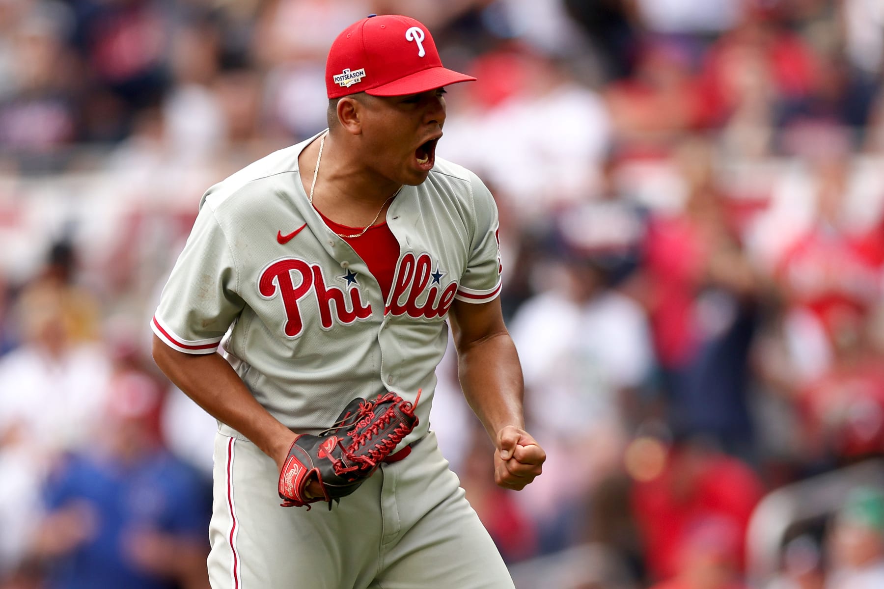 ATLANTA, GEORGIA - OCTOBER 11: Ranger Suarez #55 of the Philadelphia Phillies celebrates striking out Travis d'Arnaud #16 of the Atlanta Braves while the bases are loaded during the third inning in game one of the National League Division Series at Truist Park on October 11, 2022 in Atlanta, Georgia. (Photo by Patrick Smith/Getty Images)