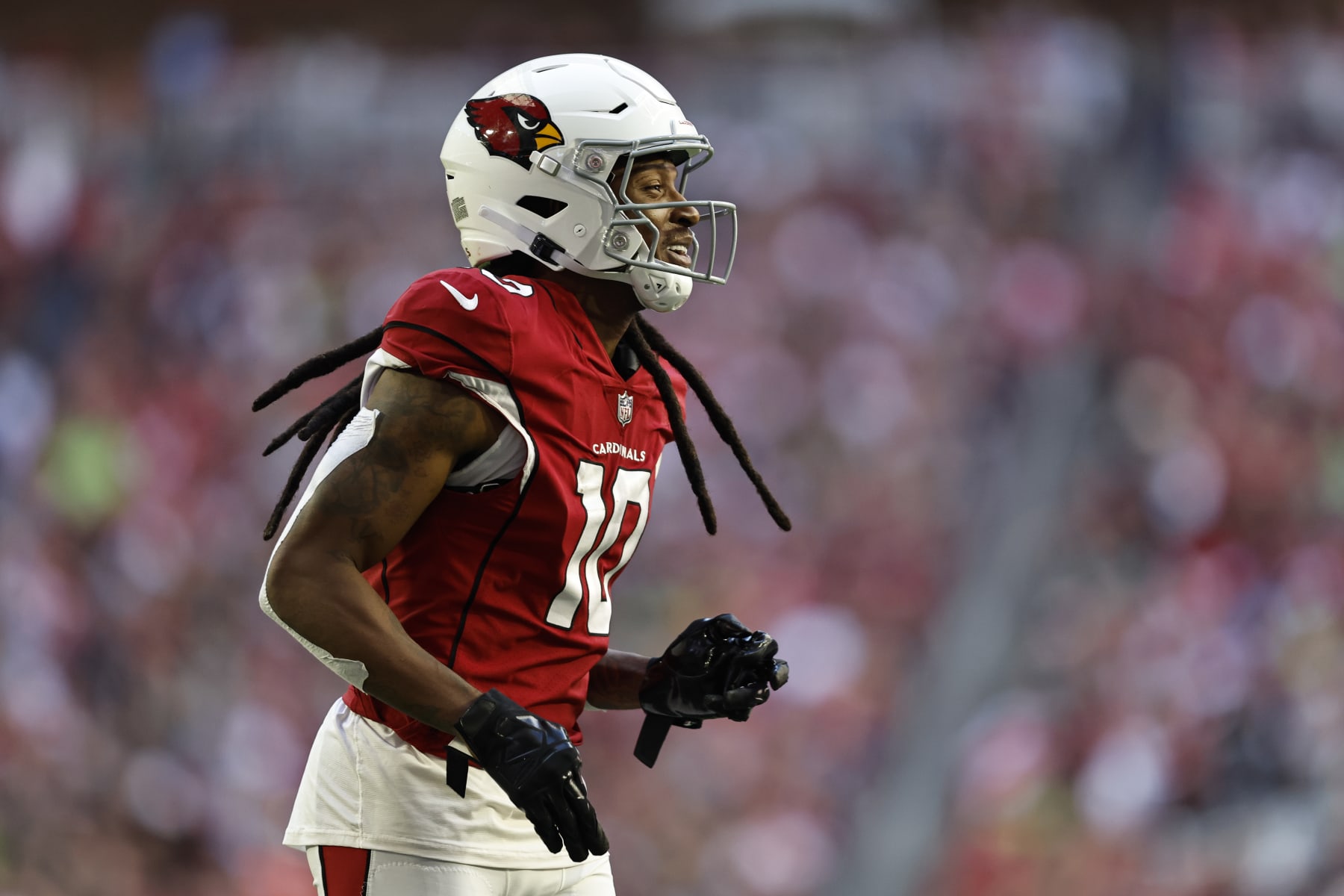 GLENDALE, ARIZONA - NOVEMBER 06: DeAndre Hopkins #10 of the Arizona Cardinals reacts as he runs during an NFL Football game between the Arizona Cardinals and the Seattle Seahawks at State Farm Stadium on November 06, 2022 in Glendale, Arizona. (Photo by Michael Owens/Getty Images)