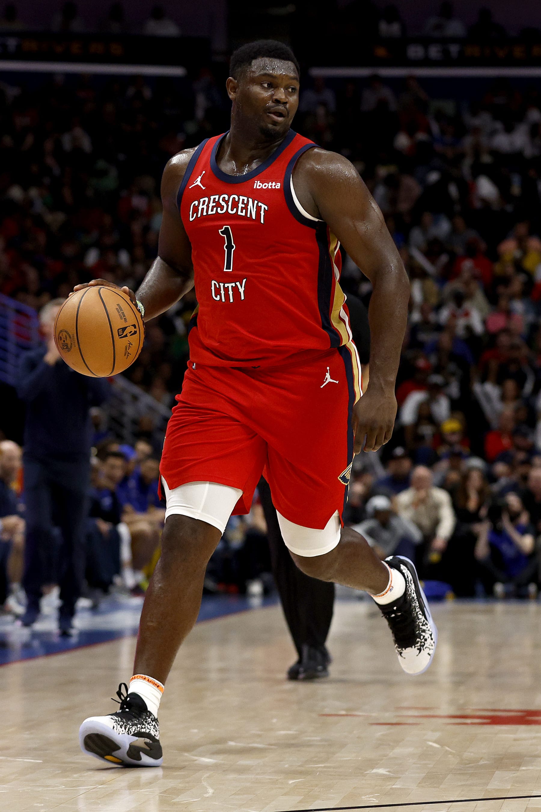 NEW ORLEANS, LOUISIANA - OCTOBER 30: Zion Williamson #1 of the New Orleans Pelicans dribbles the ball down court during the fourth quarter of an NBA game against the Golden State Warriors at Smoothie King Center on October 30, 2023 in New Orleans, Louisiana. NOTE TO USER: User expressly acknowledges and agrees that, by downloading and or using this photograph, User is consenting to the terms and conditions of the Getty Images License Agreement. (Photo by Sean Gardner/Getty Images)