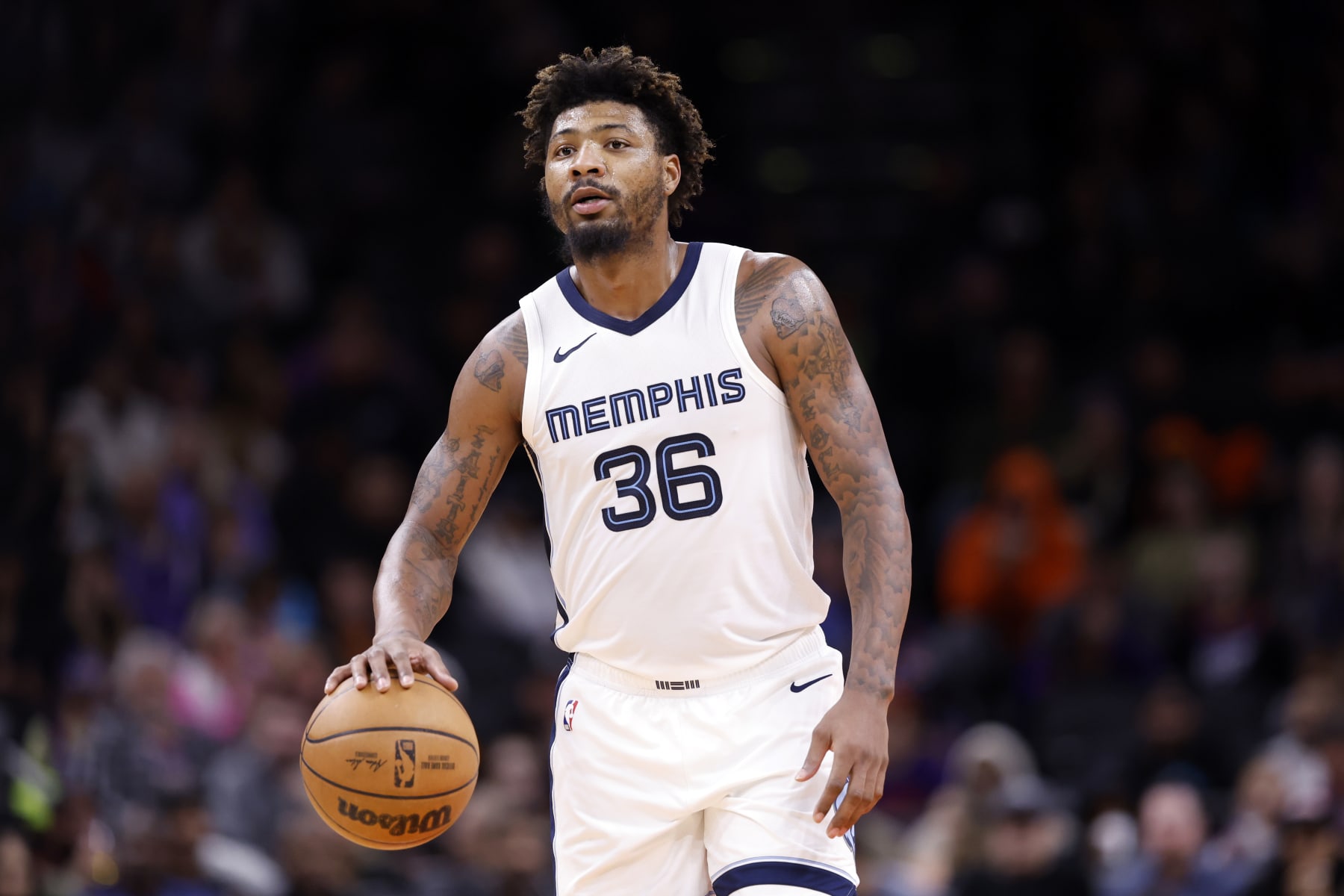 PHOENIX, ARIZONA - JANUARY 07: Marcus Smart #36 of the Memphis Grizzlies controls the ball during the game against the Phoenix Suns at Footprint Center on January 07, 2024 in Phoenix, Arizona. The Grizzlies defeated the Suns 121-115. NOTE TO USER: User expressly acknowledges and agrees that, by downloading and or using this photograph, User is consenting to the terms and conditions of the Getty Images License Agreement.  (Photo by Chris Coduto/Getty Images)