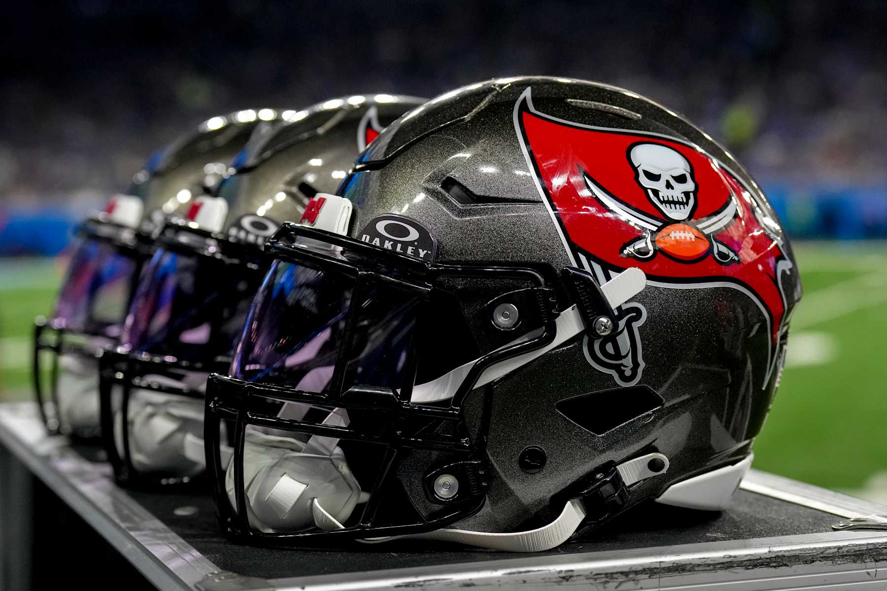 DETROIT, MICHIGAN - SEPTEMBER 15: A detail of the Tampa Bay Buccaneers logo and Oakley logo on a series of football helmets during the game against the Detroit Lions at Ford Field on September 15, 2024 in Detroit, Michigan. (Photo by Nic Antaya/Getty Images)