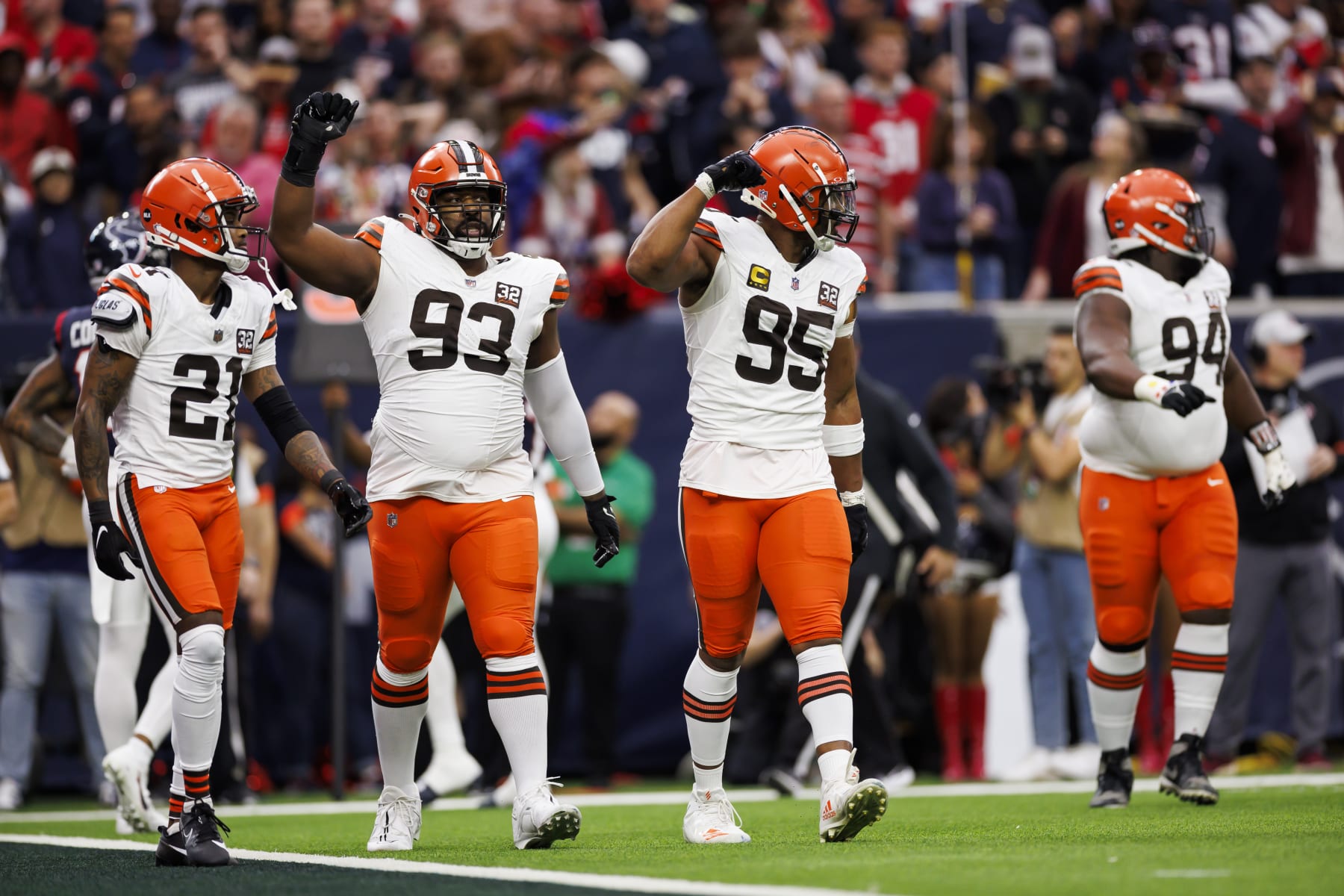 HOUSTON, TEXAS - JANUARY 13: Shelby Harris #93 of the Cleveland Browns and Myles Garrett #95 of the Cleveland Browns celebrate during an AFC wild-card playoff football game against the Houston Texans at NRG Stadium on January 13, 2024 in Houston, Texas. (Photo by Ryan Kang/Getty Images)