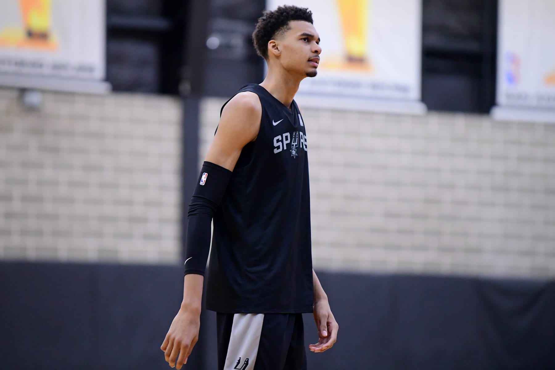 SAN ANTONIO, TX - JUNE 30: Victor Wembanyama of the San Antonio Spurs looks on during an open practice on June 30, 2023 at the AT&T Center in San Antonio, Texas. NOTE TO USER: User expressly acknowledges and agrees that, by downloading and or using this photograph, user is consenting to the terms and conditions of the Getty Images License Agreement. Mandatory Copyright Notice: Copyright 2023 NBAE (Photos by Michael Gonzales/NBAE via Getty Images)