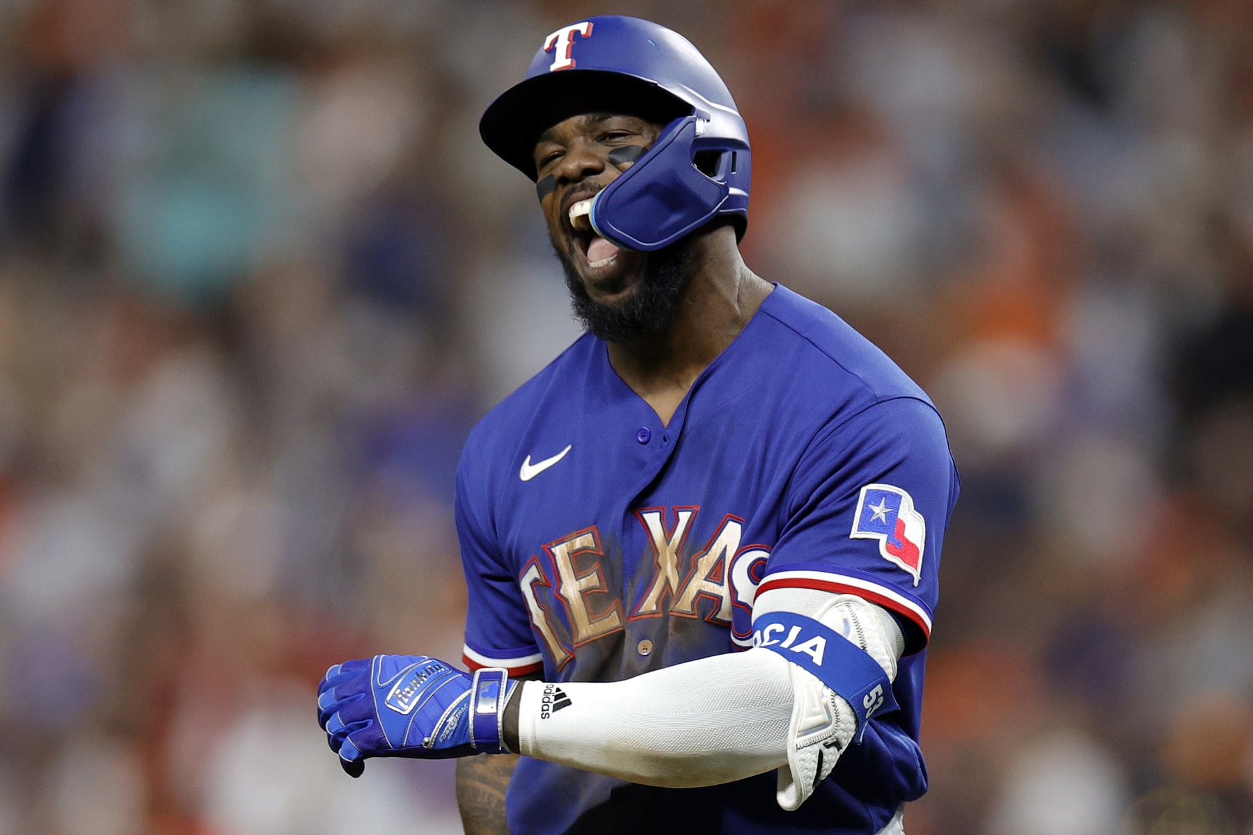 HOUSTON, TEXAS - OCTOBER 23: Adolis Garcia #53 of the Texas Rangers celebrates after hitting a solo home run against Hunter Brown #58 of the Houston Astros during the third inning  in Game Seven of the American League Championship Series at Minute Maid Park on October 23, 2023 in Houston, Texas. (Photo by Carmen Mandato/Getty Images)