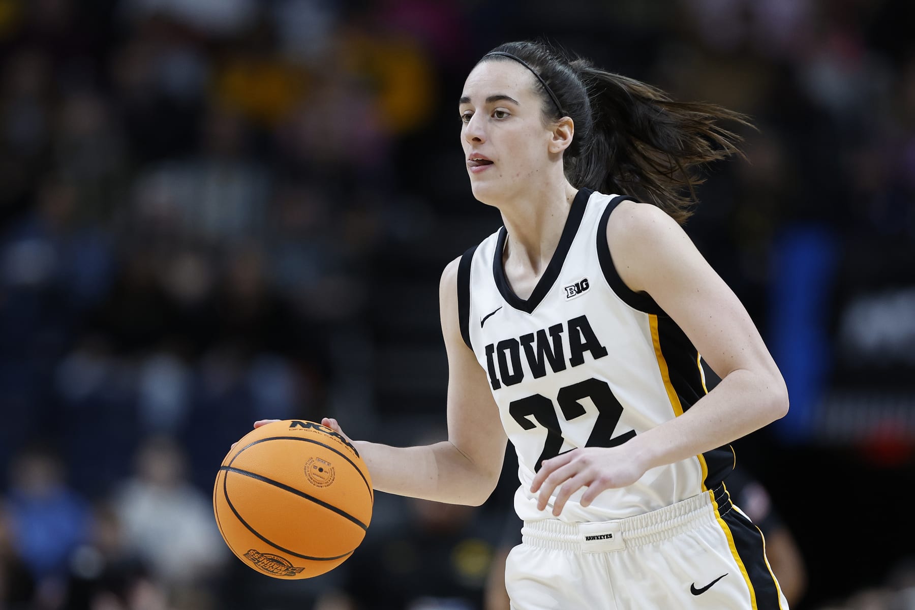 ALBANY, NEW YORK - APRIL 01: Caitlin Clark #22 of the Iowa Hawkeyes dribbles during the first half against the LSU Tigers in the Elite 8 round of the NCAA Women's Basketball Tournament at MVP Arena on April 01, 2024 in Albany, New York. (Photo by Sarah Stier/Getty Images)