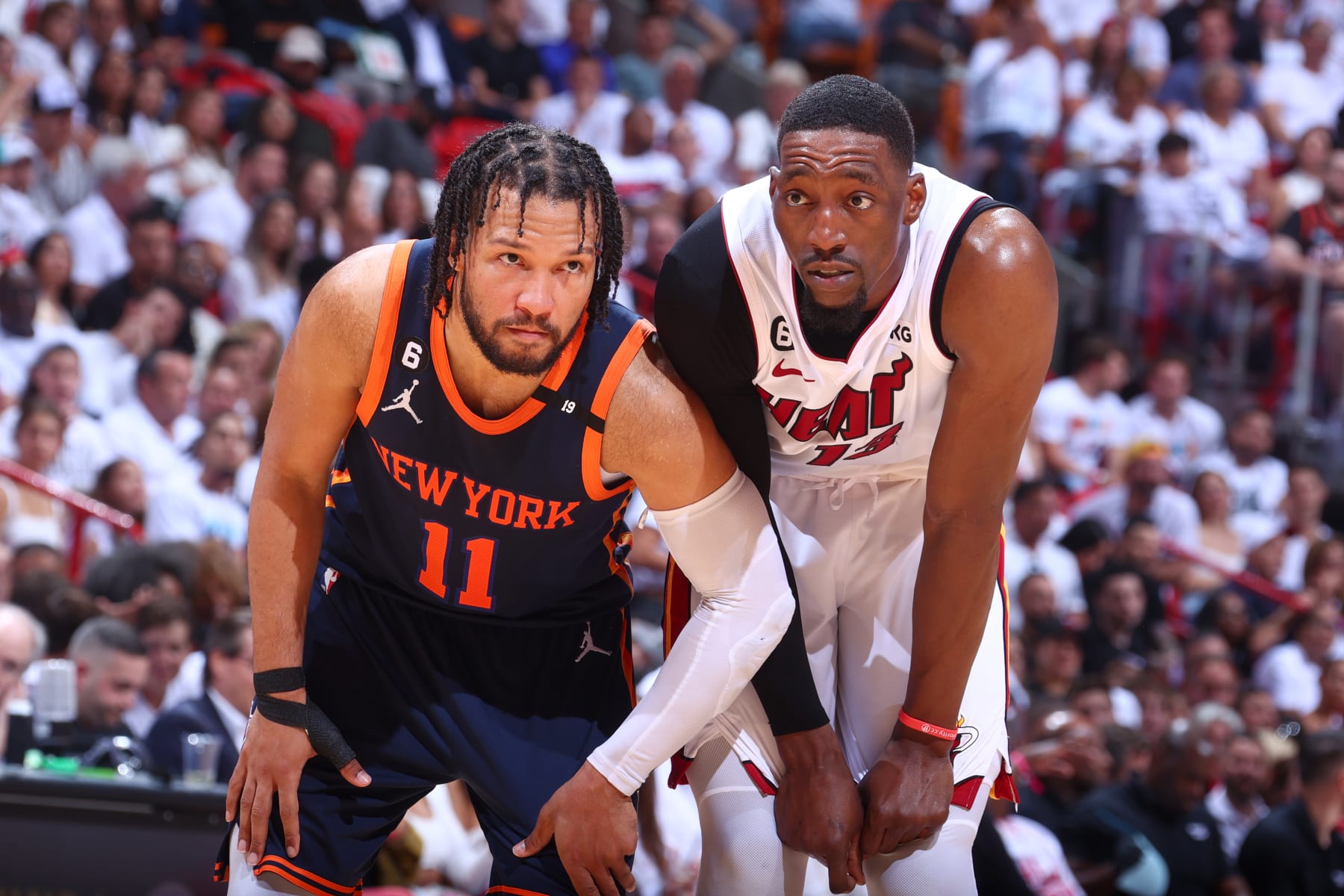 MIAMI, FL - MAY 12: Jalen Brunson #11 of the New York Knicks and Bam Adebayo #13 of the Miami Heat look on during Game 6 of the 2023 NBA Playoffs Eastern Conference semi-finals on May 12, 2023 at Kaseya Center in Miami, Florida. NOTE TO USER: User expressly acknowledges and agrees that, by downloading and or using this Photograph, user is consenting to the terms and conditions of the Getty Images License Agreement. Mandatory Copyright Notice: Copyright 2023 NBAE (Photo by Nathaniel S. Butler/NBAE via Getty Images)