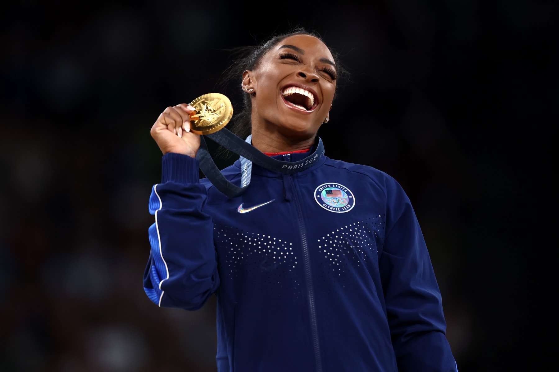 PARIS, FRANCE - AUGUST 03: Gold medalist Simone Biles of Team United States celebrates on the podium during the medal ceremony for the Artistic Gymnastics Women's Vault Final on day eight of the Olympic Games Paris 2024 at Bercy Arena on August 03, 2024 in Paris, France. (Photo by Naomi Baker/Getty Images)