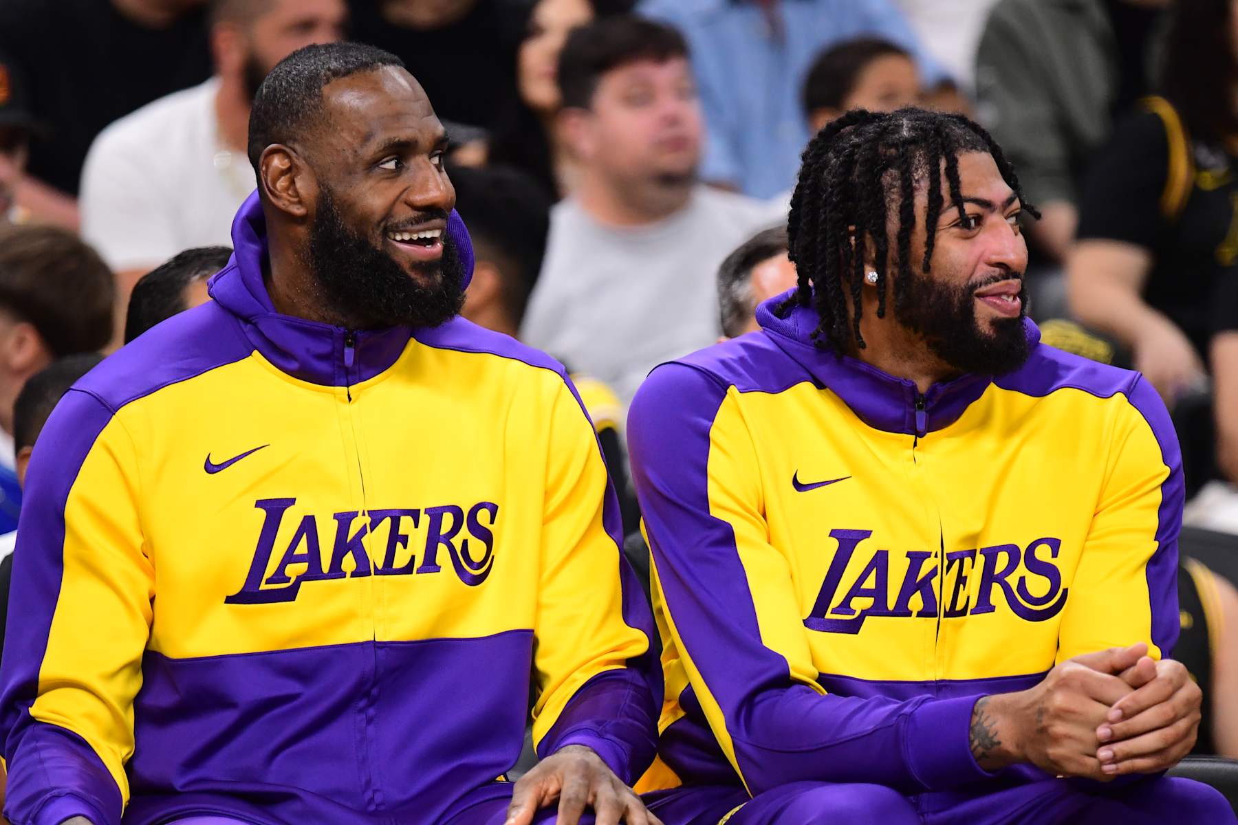 LOS ANGELES, CA - OCTOBER 6: LeBron James #23 and Anthony Davis #3 of the Los Angeles Lakers smiles while sitting on the bench against the Phoenix Suns on October 6, 2024 at Acrisure Arena in Palm Springs, California. NOTE TO USER: User expressly acknowledges and agrees that, by downloading and/or using this Photograph, user is consenting to the terms and conditions of the Getty Images License Agreement. Mandatory Copyright Notice: Copyright 2024 NBAE (Photo by Adam Pantozzi/NBAE via Getty Images)