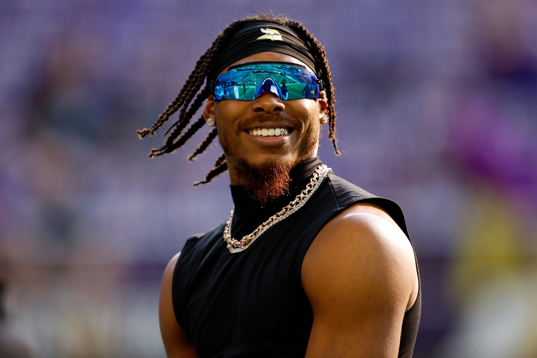 MINNEAPOLIS, MINNESOTA - AUGUST 19: Justin Jefferson #18 of the Minnesota Vikings looks on prior to the start of a preseason game against the Tennessee Titans at U.S. Bank Stadium on August 19, 2023 in Minneapolis, Minnesota. The Titans defeated the Vikings 24-16. (Photo by David Berding/Getty Images)