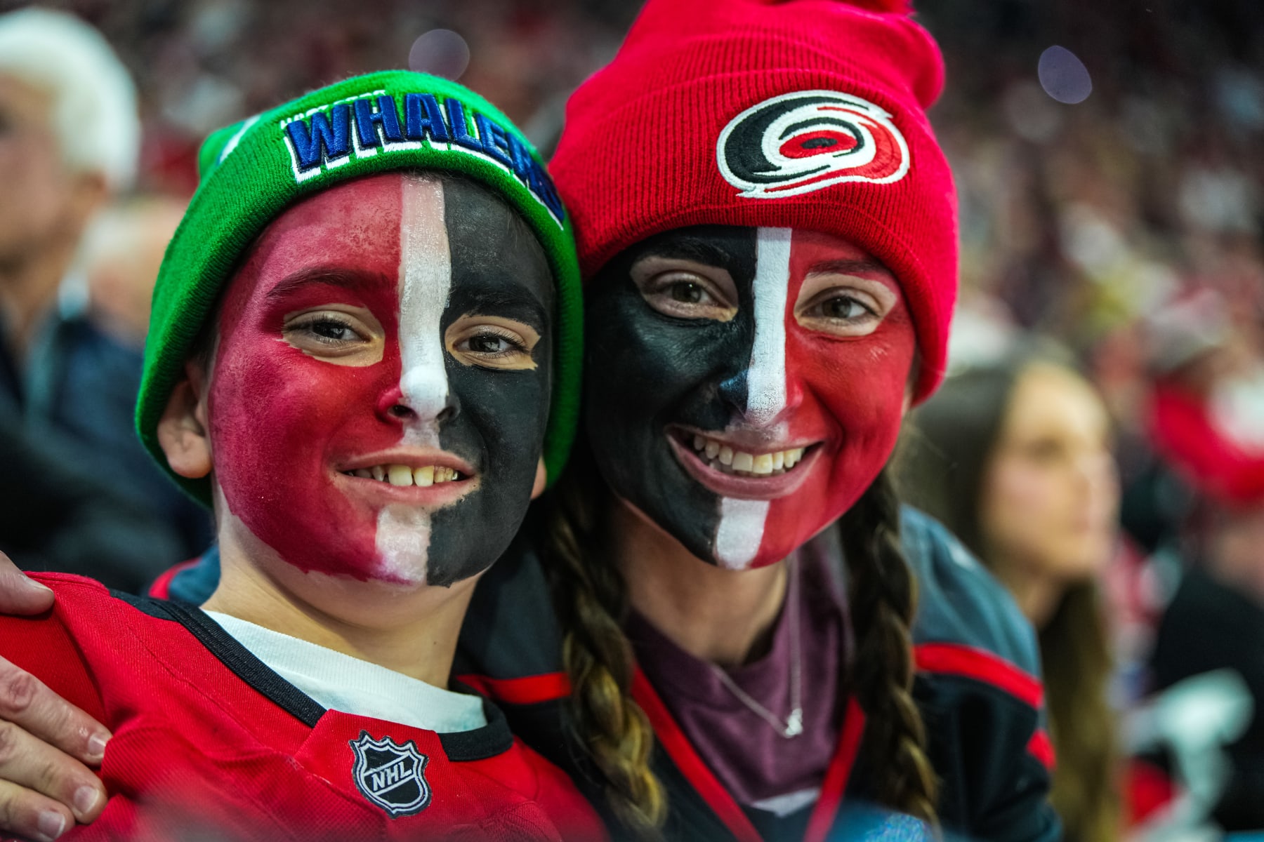RALEIGH, NORTH CAROLINA - MAY 03: Carolina Hurricanes fans pose for a photo during the third period against the New Jersey Devils in Game One of the Second Round of the 2023 Stanley Cup Playoffs at PNC Arena on May 03, 2023 in Raleigh, North Carolina. (Photo by Josh Lavallee/NHLI via Getty Images)