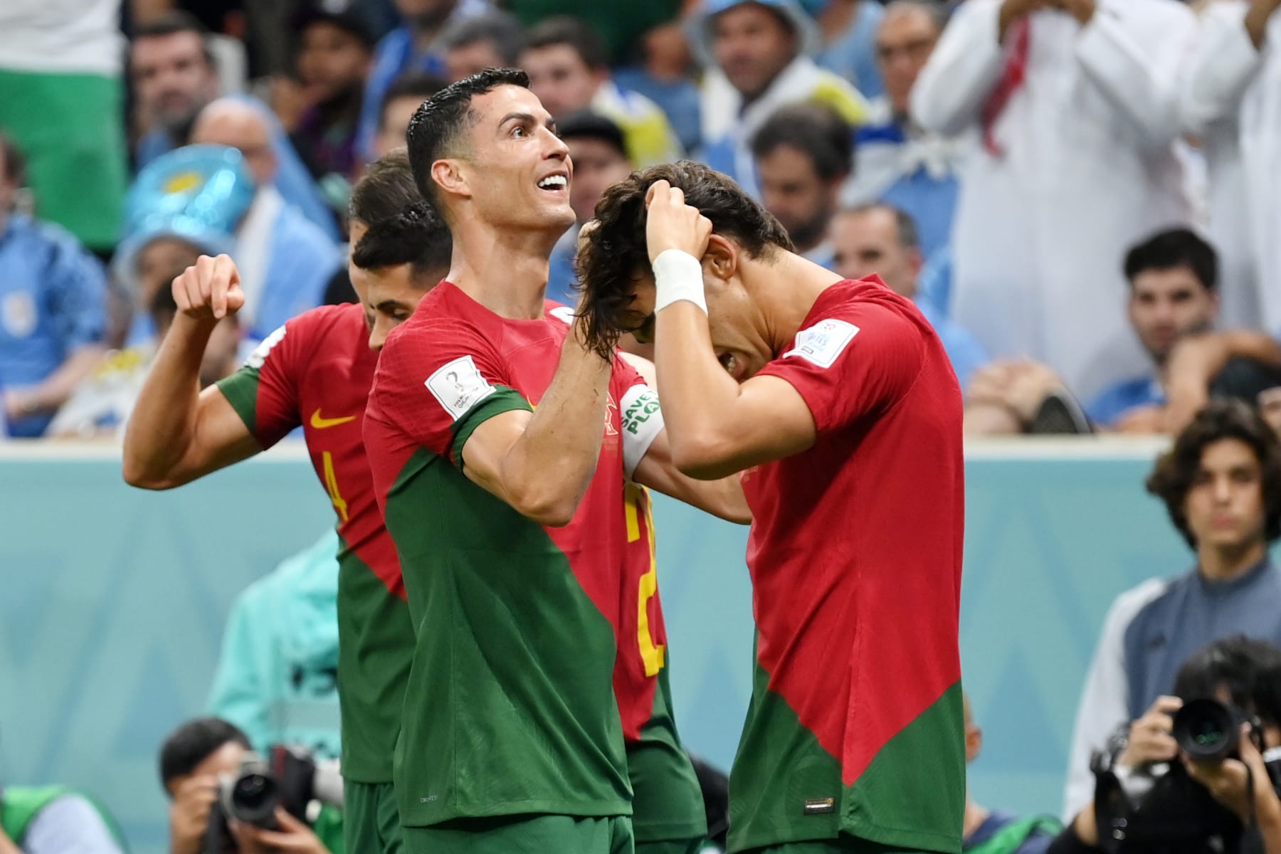 LUSAIL CITY, QATAR - NOVEMBER 28: Cristiano Ronaldo of Portugal celebrates with teammates after scoring their team's first goal during the FIFA World Cup Qatar 2022 Group H match between Portugal and Uruguay at Lusail Stadium on November 28, 2022 in Lusail City, Qatar. (Photo by Justin Setterfield/Getty Images)