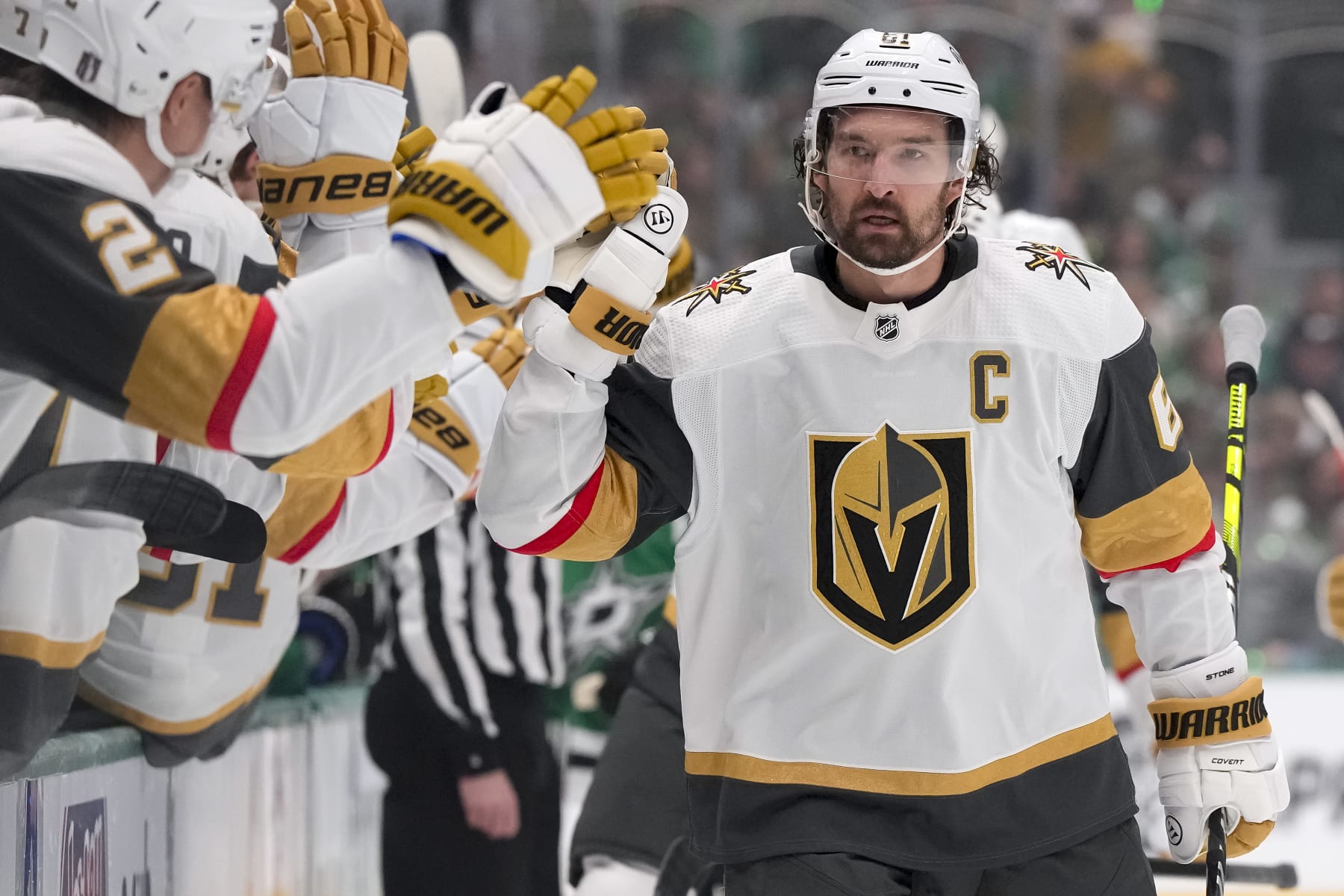 DALLAS, TEXAS - APRIL 22: Mark Stone #61 of the Vegas Golden Knights congratulated by his bench after scoring a goal in Game One of the First Round of the 2024 Stanley Cup Playoffs against the Dallas Stars at the American Airlines Center on April 22, 2024 in Dallas, Texas. (Photo by Sam Hodde/Getty Images)