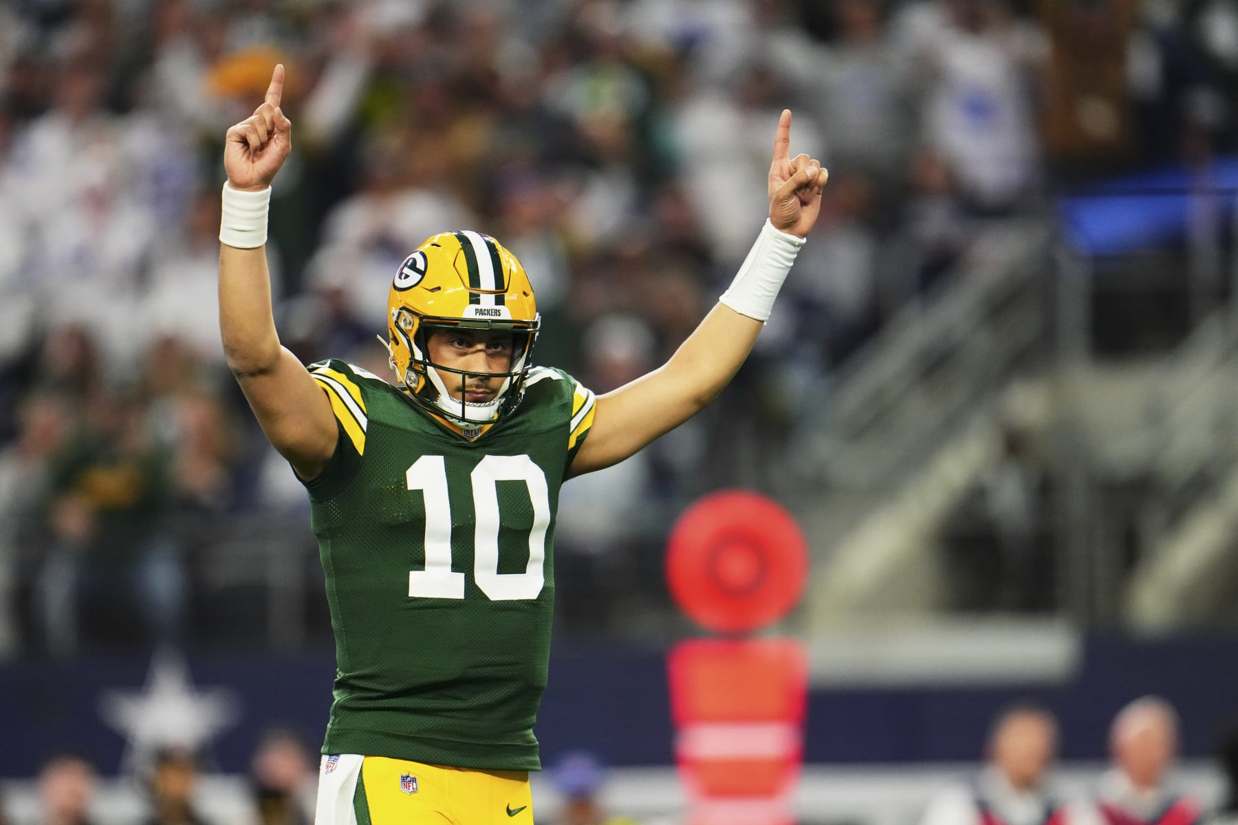 DALLAS, TX - JANUARY 14: Jordan Love #10 of the Green Bay Packers celebrates after scoring a touchdown against the Dallas Cowboys during the first half of the NFC Wild Card playoff game at AT&T Stadium on January 14, 2024 in Dallas, Texas. (Photo by Cooper Neill/Getty Images)