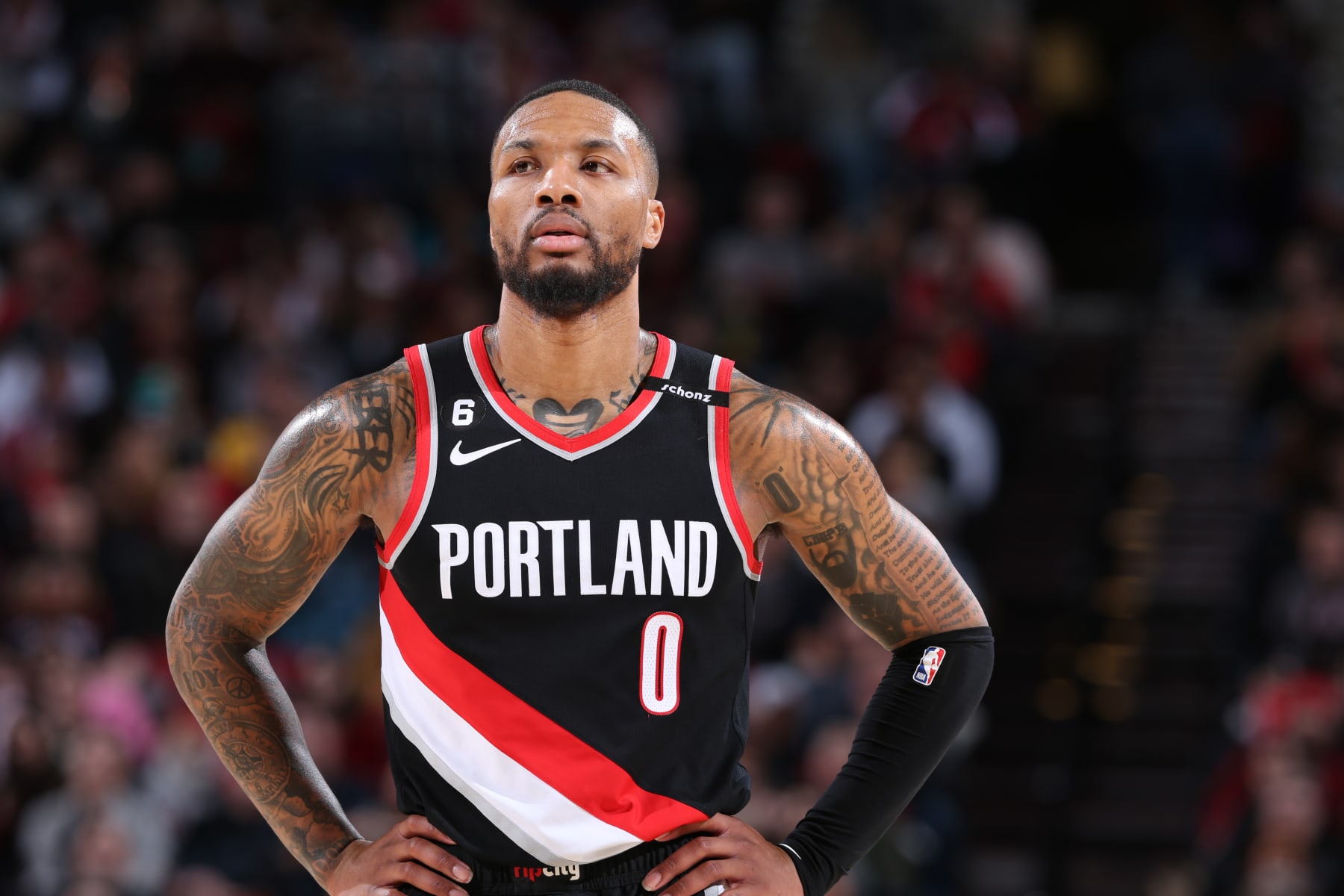 PORTLAND, OR - JANUARY 30: Damian Lillard #0 of the Portland Trail Blazers looks on during the game against the Atlanta Hawks on January 30, 2023 at the Moda Center Arena in Portland, Oregon. NOTE TO USER: User expressly acknowledges and agrees that, by downloading and or using this photograph, user is consenting to the terms and conditions of the Getty Images License Agreement. Mandatory Copyright Notice: Copyright 2023 NBAE (Photo by Sam Forencich/NBAE via Getty Images)