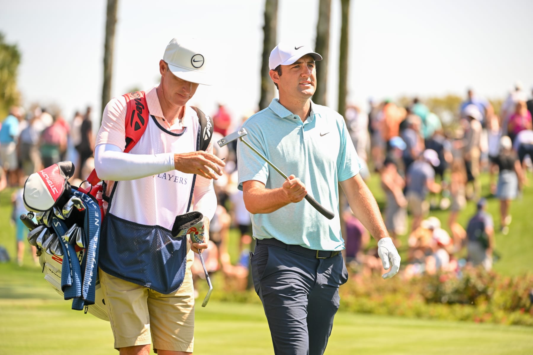 PONTE VEDRA BEACH, FLORIDA - MARCH 12: Scottie Scheffler hands his caddie a club on the third fairway during the final round of THE PLAYERS Championship at Stadium Course at TPC Sawgrass on March 12, 2023 in Ponte Vedra Beach, Florida. (Photo by Ben Jared/PGA TOUR via Getty Images)