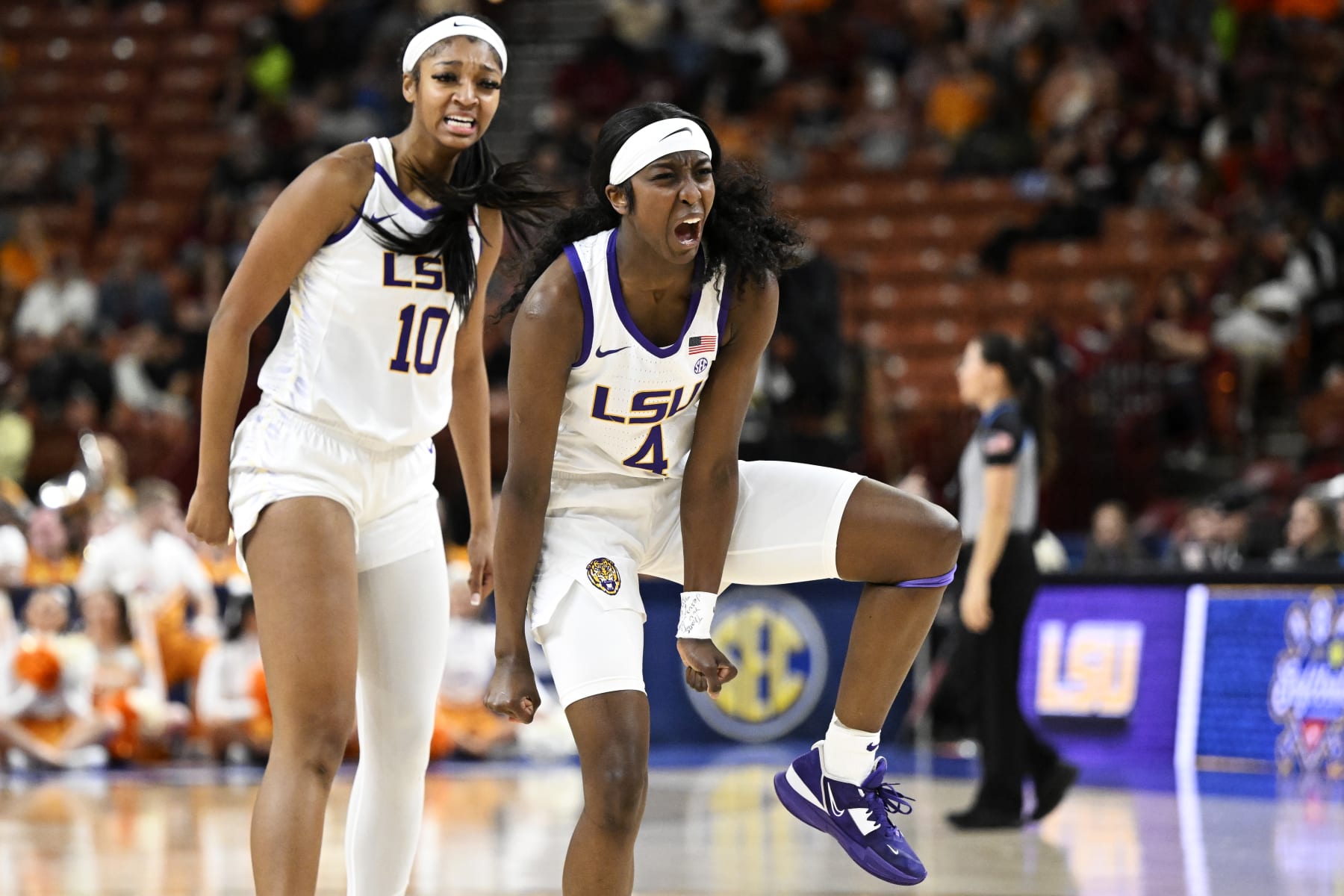 GREENVILLE, SOUTH CAROLINA - MARCH 04: Flau'jae Johnson #4 and Angel Reese #10 of the LSU Lady Tigers celebrate the Tennessee Lady Vols calling a time-out in the second quarter during the semifinals of the SEC Women's Basketball Tournament at Bon Secours Wellness Arena on March 04, 2023 in Greenville, South Carolina. (Photo by Eakin Howard/Getty Images)