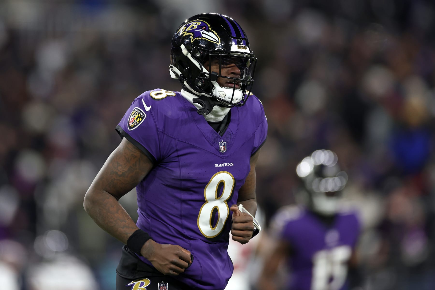 BALTIMORE, MARYLAND - JANUARY 20: Lamar Jackson #8 of the Baltimore Ravens reacts after a play against the Houston Texans during the second quarter in the AFC Divisional Playoff game at M&T Bank Stadium on January 20, 2024 in Baltimore, Maryland. (Photo by Patrick Smith/Getty Images)