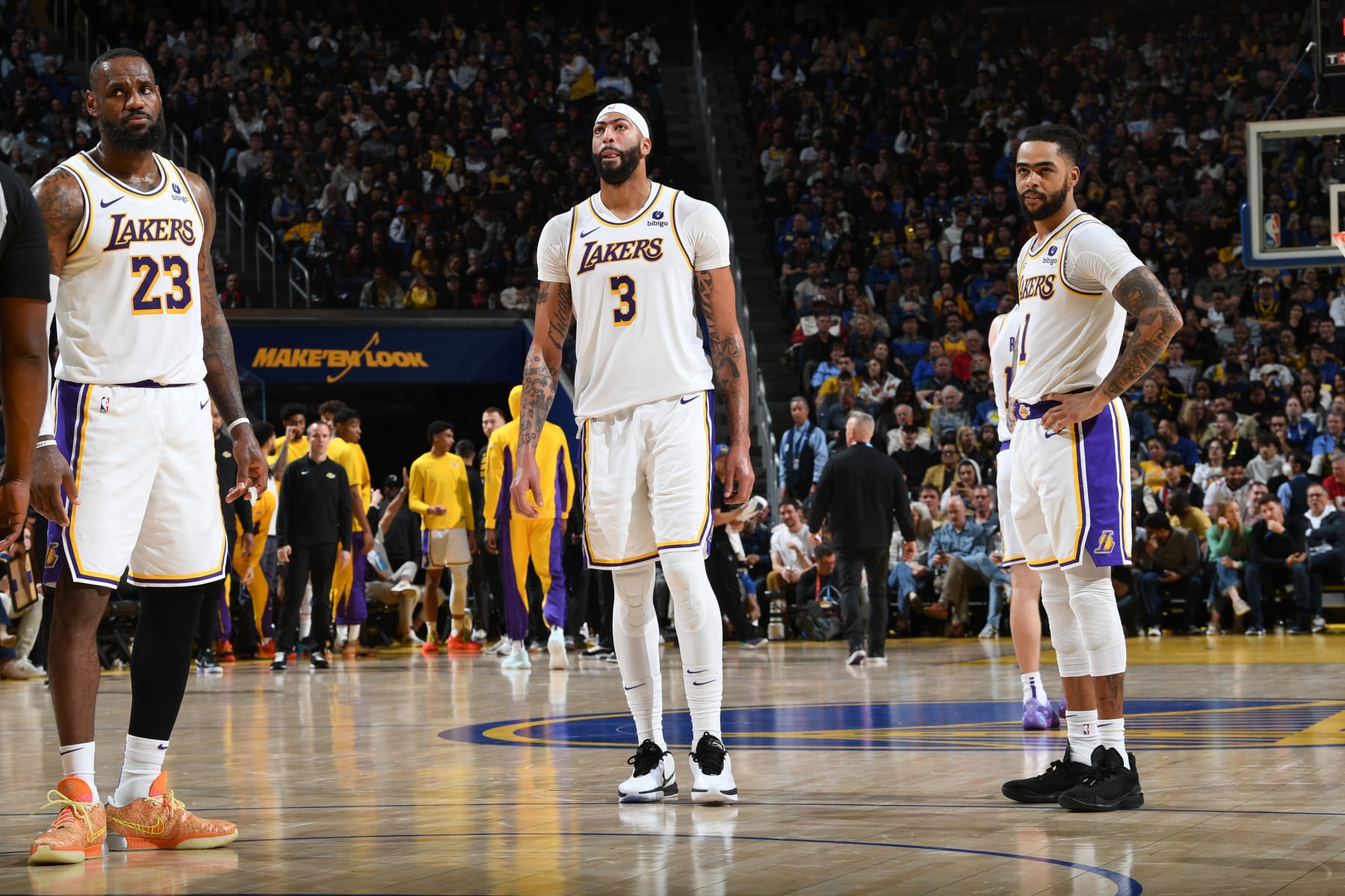 SAN FRANCISCO, CA - JANUARY 27: LeBron James #23, Anthony Davis #3 and D'Angelo Russell #1 of the Los Angeles Lakers look on during the game against the Golden State Warriors on January 27, 2024 at Chase Center in San Francisco, California. NOTE TO USER: User expressly acknowledges and agrees that, by downloading and or using this photograph, user is consenting to the terms and conditions of Getty Images License Agreement. Mandatory Copyright Notice: Copyright 2024 NBAE (Photo by Noah Graham/NBAE via Getty Images)