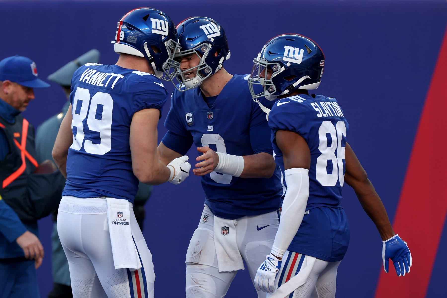 EAST RUTHERFORD, NEW JERSEY - JANUARY 01: Daniel Jones #8 of the New York Giants is congratulated by teammates after scoring a touchdown against the Indianapolis Colts during the third quarter at MetLife Stadium on January 01, 2023 in East Rutherford, New Jersey. (Photo by Jamie Squire/Getty Images)