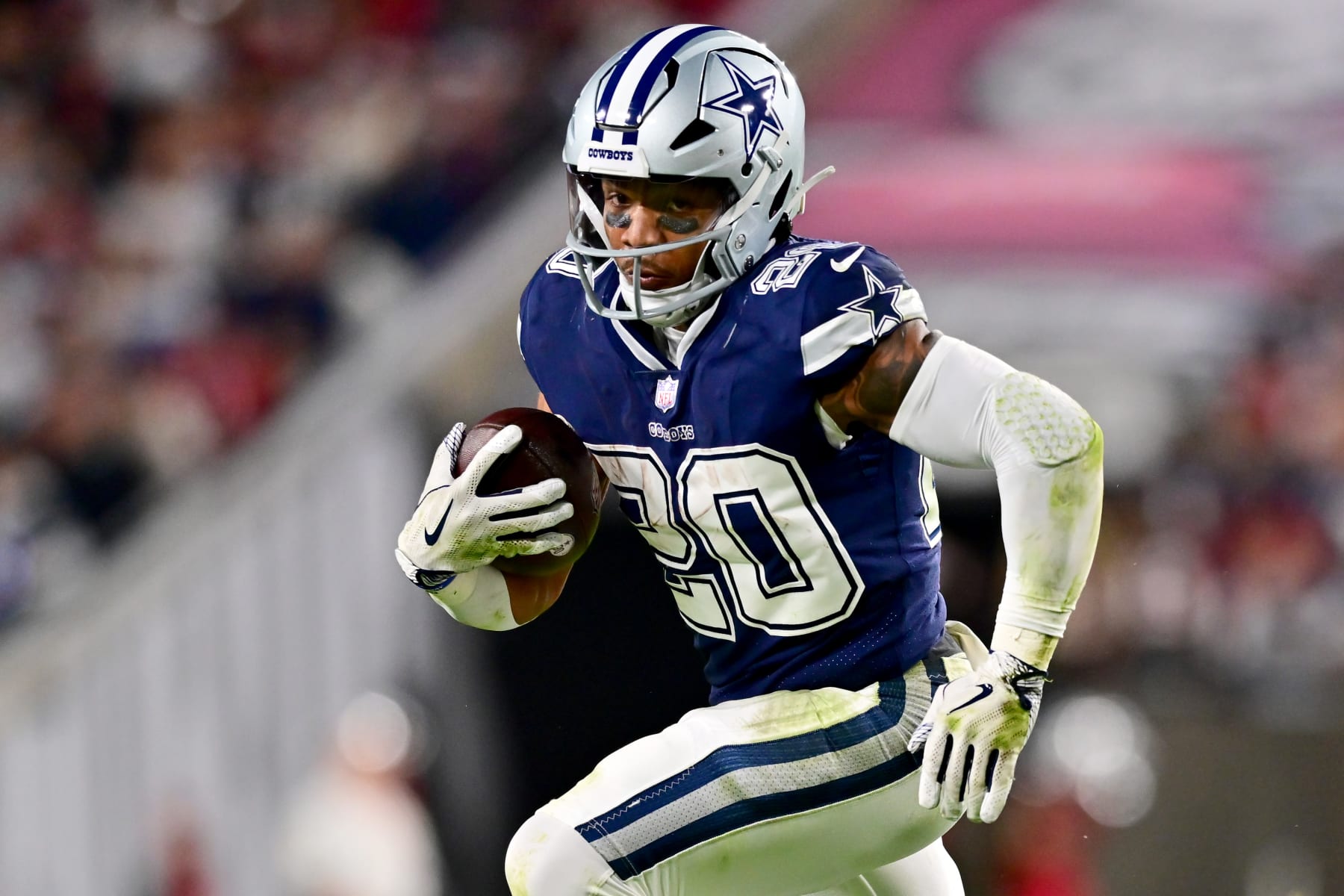 TAMPA, FLORIDA - JANUARY 16: Tony Pollard #20 of the Dallas Cowboys carries the ball against the Tampa Bay Buccaneers during the first half in the NFC Wild Card playoff game at Raymond James Stadium on January 16, 2023 in Tampa, Florida. (Photo by Julio Aguilar/Getty Images)