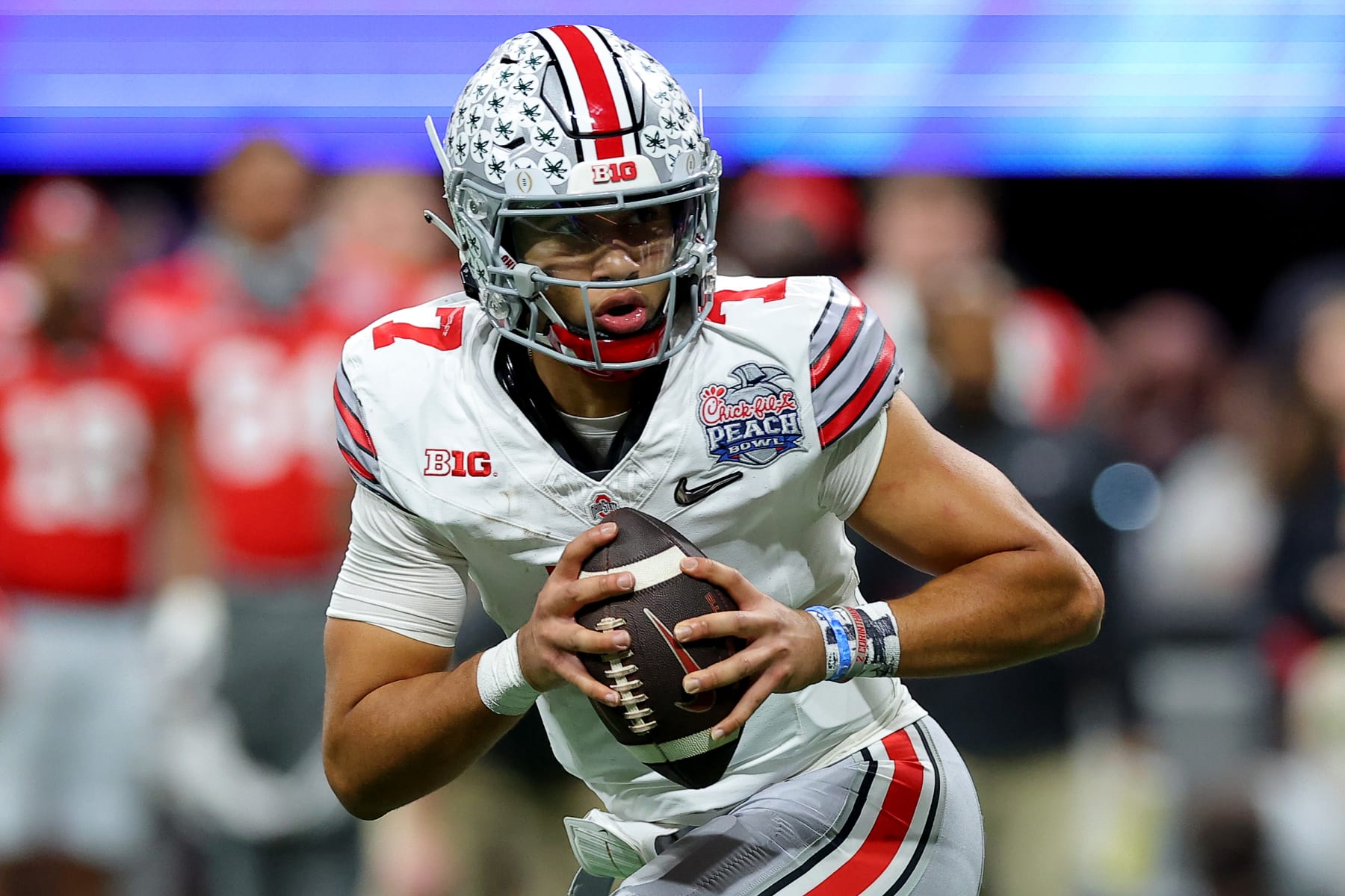ATLANTA, GEORGIA - DECEMBER 31: C.J. Stroud #7 of the Ohio State Buckeyes looks to pass during the third quarter against the Georgia Bulldogs in the Chick-fil-A Peach Bowl at Mercedes-Benz Stadium on December 31, 2022 in Atlanta, Georgia. (Photo by Kevin C. Cox/Getty Images)