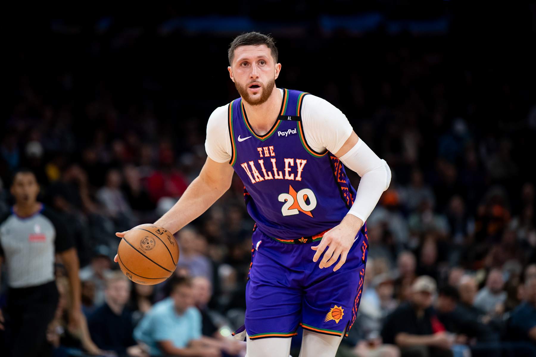 PHOENIX, ARIZONA - DECEMBER 21: Jusuf Nurkic #20 of the Phoenix Suns controls the ball during the second half of the NBA game against the Detroit Pistons at Footprint Center on December 21, 2024 in Phoenix, Arizona. The Pistons defeated the Suns 133-125. NOTE TO USER: User expressly acknowledges and agrees that, by downloading and or using this photograph, User is consenting to the terms and conditions of the Getty Images License Agreement. (Photo by Kelsey Grant/Getty Images)