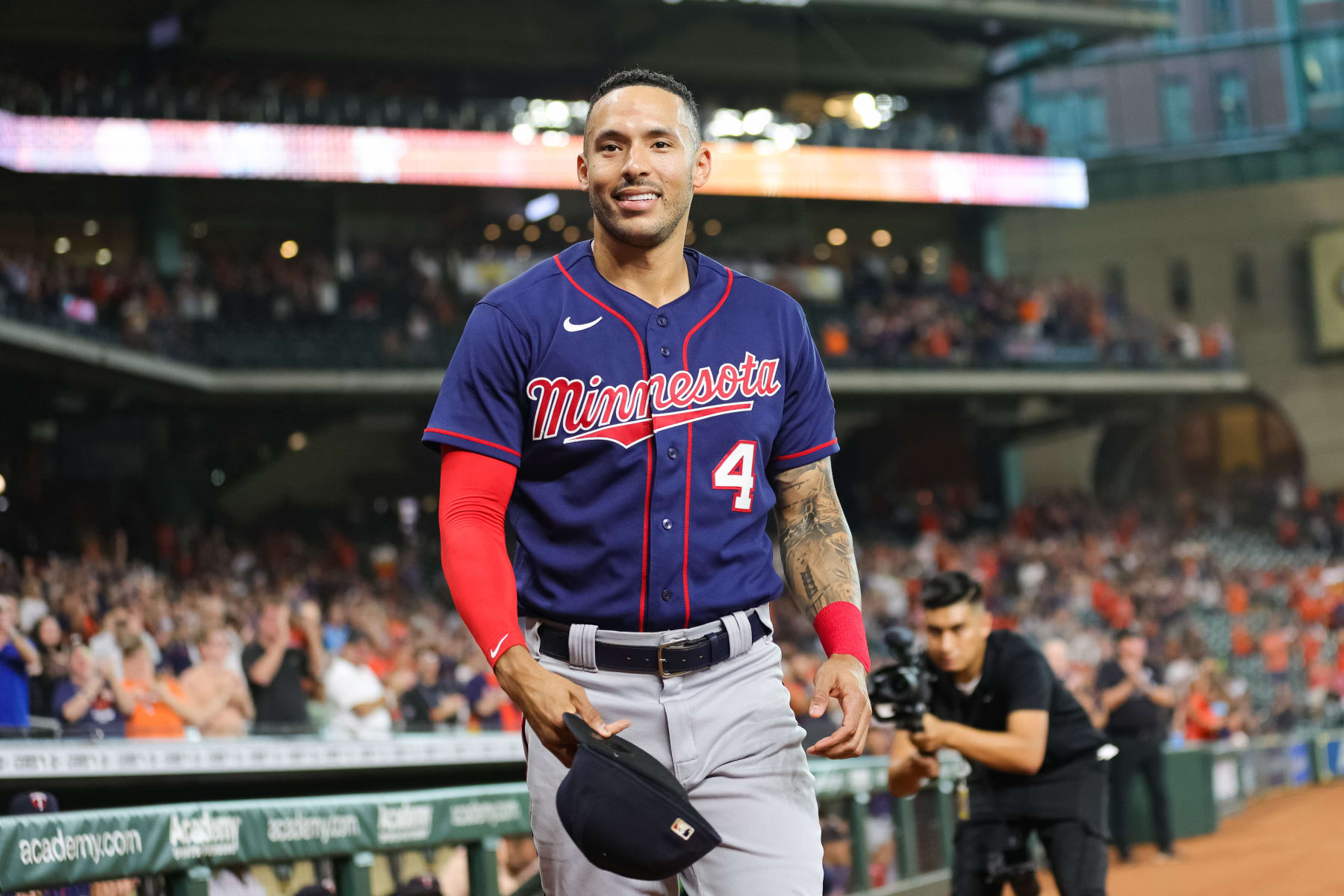 HOUSTON, TEXAS - AUGUST 23: Carlos Correa #4 of the Minnesota Twins gestures to the crowd in his first visit back to Minute Maid Park to face the Houston Astros on August 23, 2022 in Houston, Texas. (Photo by Carmen Mandato/Getty Images)