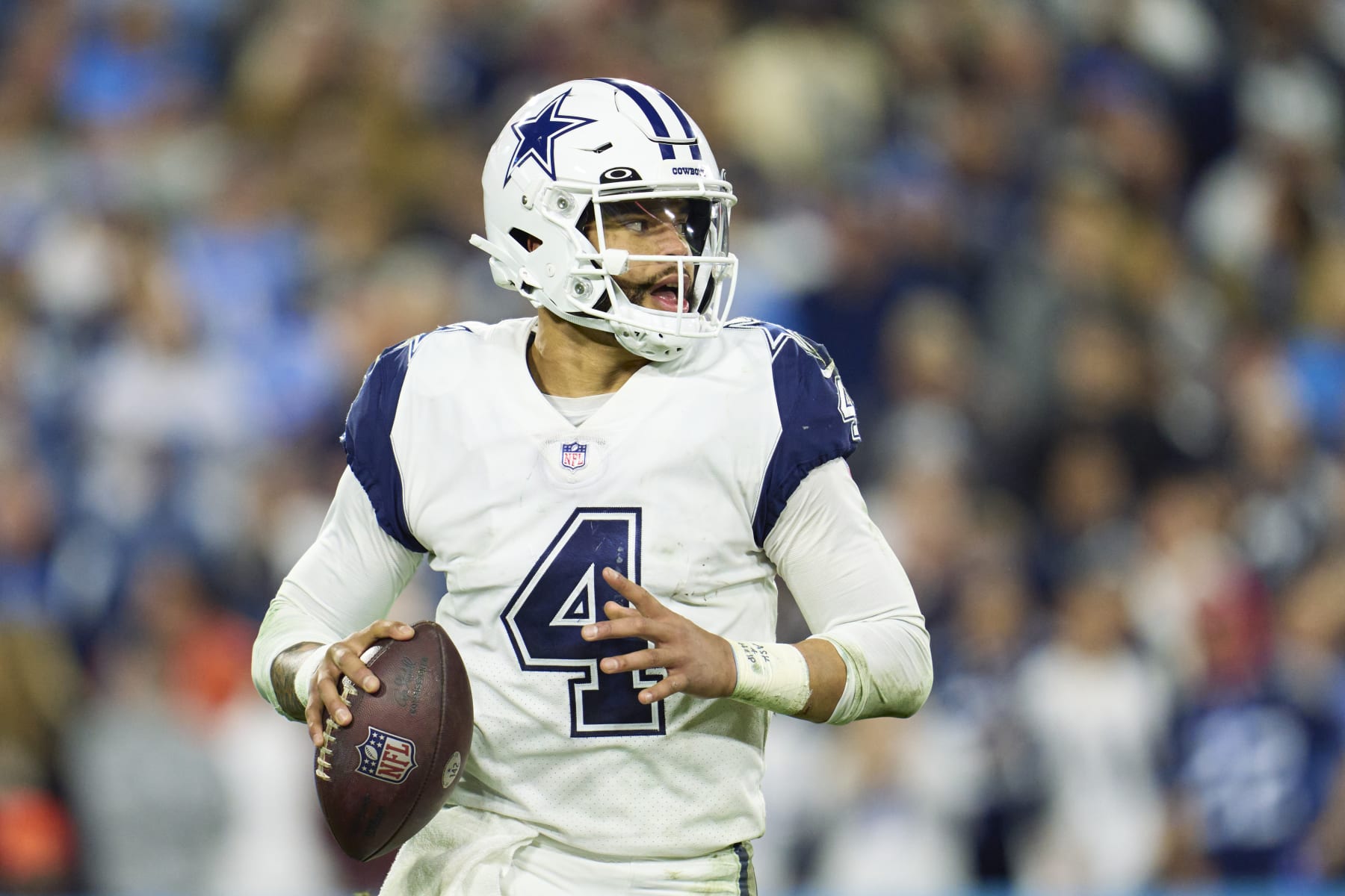 NASHVILLE, TN - DECEMBER 29: Dak Prescott #4 of the Dallas Cowboys scrambles against the Tennessee Titans during the second half at Nissan Stadium on December 29, 2022 in Nashville, Tennessee. (Photo by Cooper Neill/Getty Images)