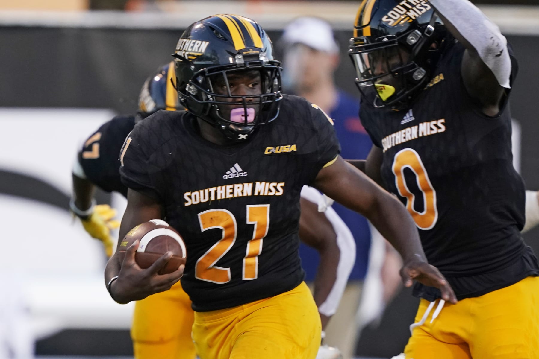 Southern Mississippi running back Frank Gore Jr. (21) looks for blockers as he scores on a 51-yard touchdown pass reception during the on a second half of an NCAA college football game against UTSA, Saturday, Nov. 21, 2020, in Hattiesburg, Miss. UTSA won 23-20. (AP Photo/Rogelio V. Solis)