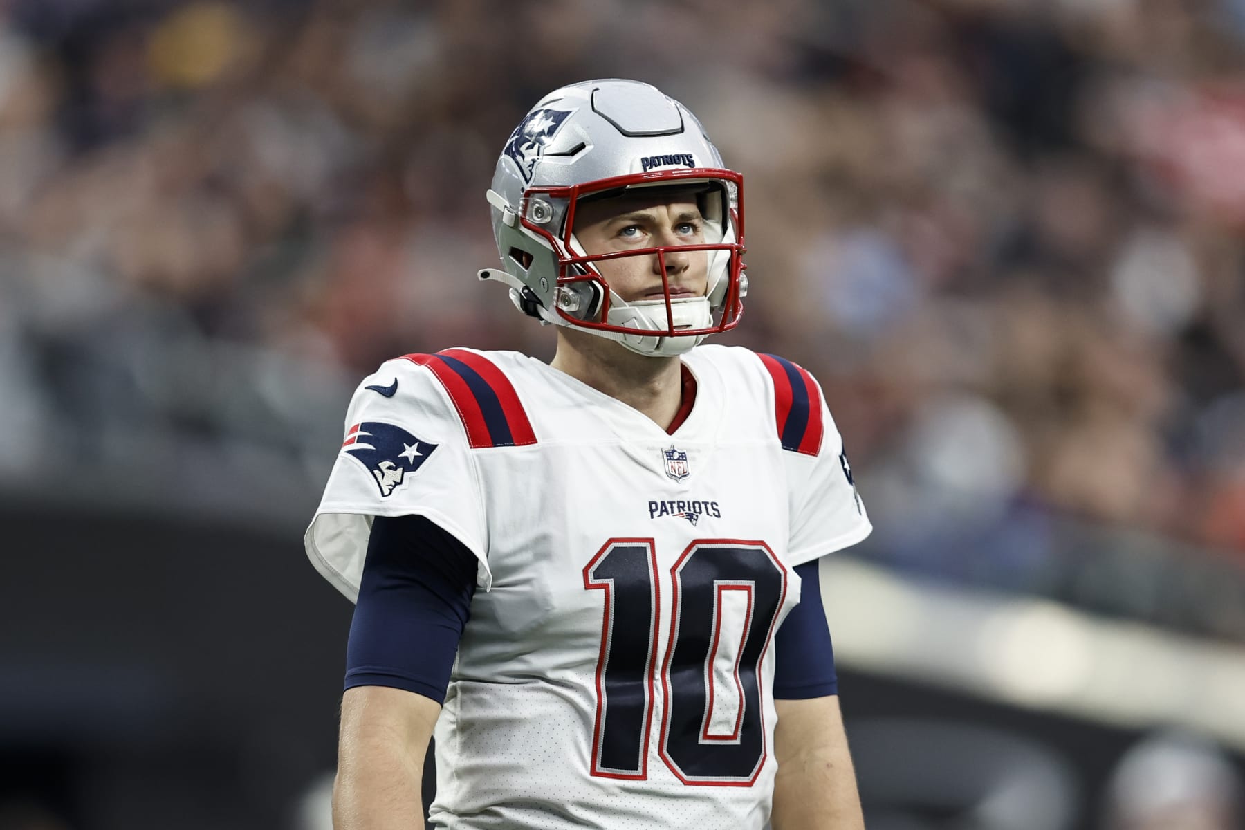 LAS VEGAS, NEVADA - DECEMBER 18: Mac Jones #10 of the New England Patriots reacts as he looks on during an NFL football game between the Las Vegas Raiders and the New England Patriots at Allegiant Stadium on December 18, 2022 in Las Vegas, Nevada. (Photo by Michael Owens/Getty Images)
