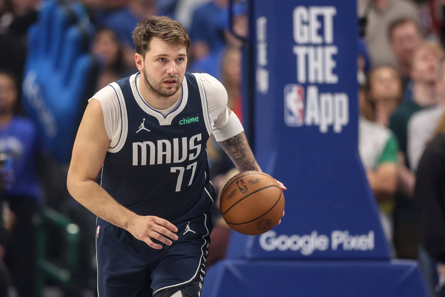 DALLAS, TEXAS - APRIL 28: Luka Doncic #77 of the Dallas Mavericks brings the ball up court against the Los Angeles Clippers in the first half of game four of the Western Conference First Round Playoffs at American Airlines Center on April 28, 2024 in Dallas, Texas.  NOTE TO USER: User expressly acknowledges and agrees that, by downloading and or using this photograph, User is consenting to the terms and conditions of the Getty Images License Agreement. (Photo by Tim Warner/Getty Images)