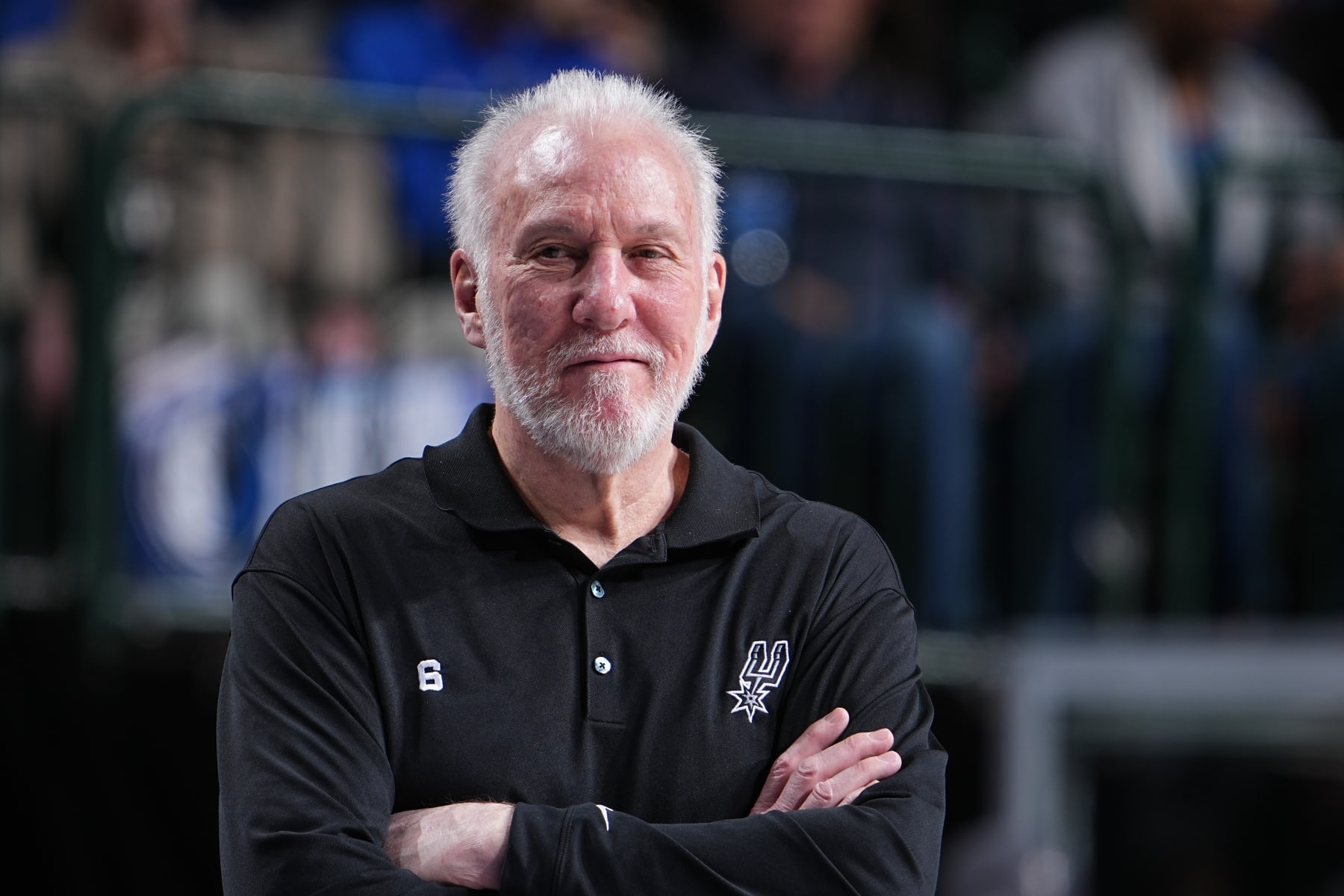 DALLAS, TX - FEBRUARY 23: Head Coach Gregg Popovich of the San Antonio Spurs smiles during the game against the Dallas Mavericks on February 23, 2023 at the American Airlines Center in Dallas, Texas. NOTE TO USER: User expressly acknowledges and agrees that, by downloading and or using this photograph, User is consenting to the terms and conditions of the Getty Images License Agreement. Mandatory Copyright Notice: Copyright 2023 NBAE (Photo by Glenn James/NBAE via Getty Images)