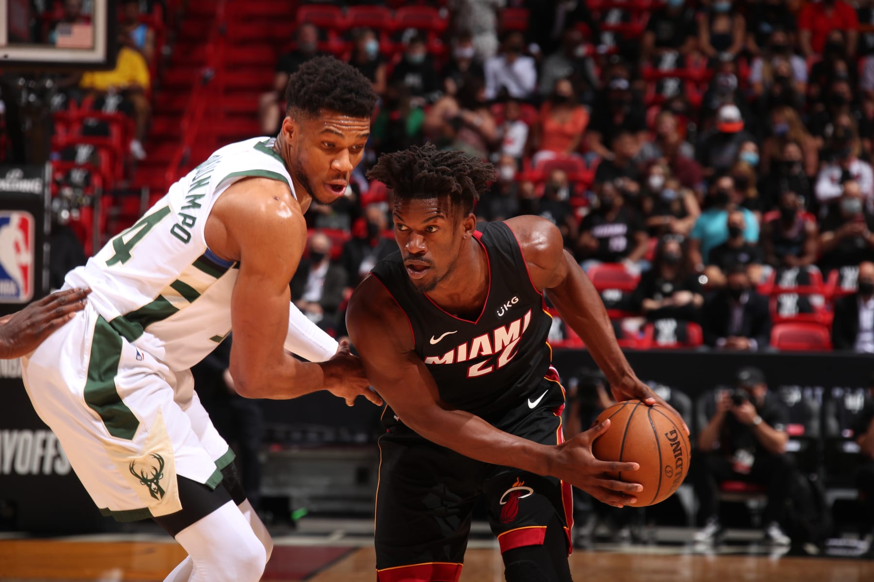 MIAMI, FL - MAY 29: Giannis Antetokounmpo #34 of the Milwaukee Bucks plays defense on Jimmy Butler #22 of the Miami Heat during Round 1, Game 4 of the 2021 NBA Playoffs on May 29, 2021 at American Airlines Arena in Miami, Florida. NOTE TO USER: User expressly acknowledges and agrees that, by downloading and or using this Photograph, user is consenting to the terms and conditions of the Getty Images License Agreement. Mandatory Copyright Notice: Copyright 2021 NBAE (Photo by Issac Baldizon/NBAE via Getty Images)