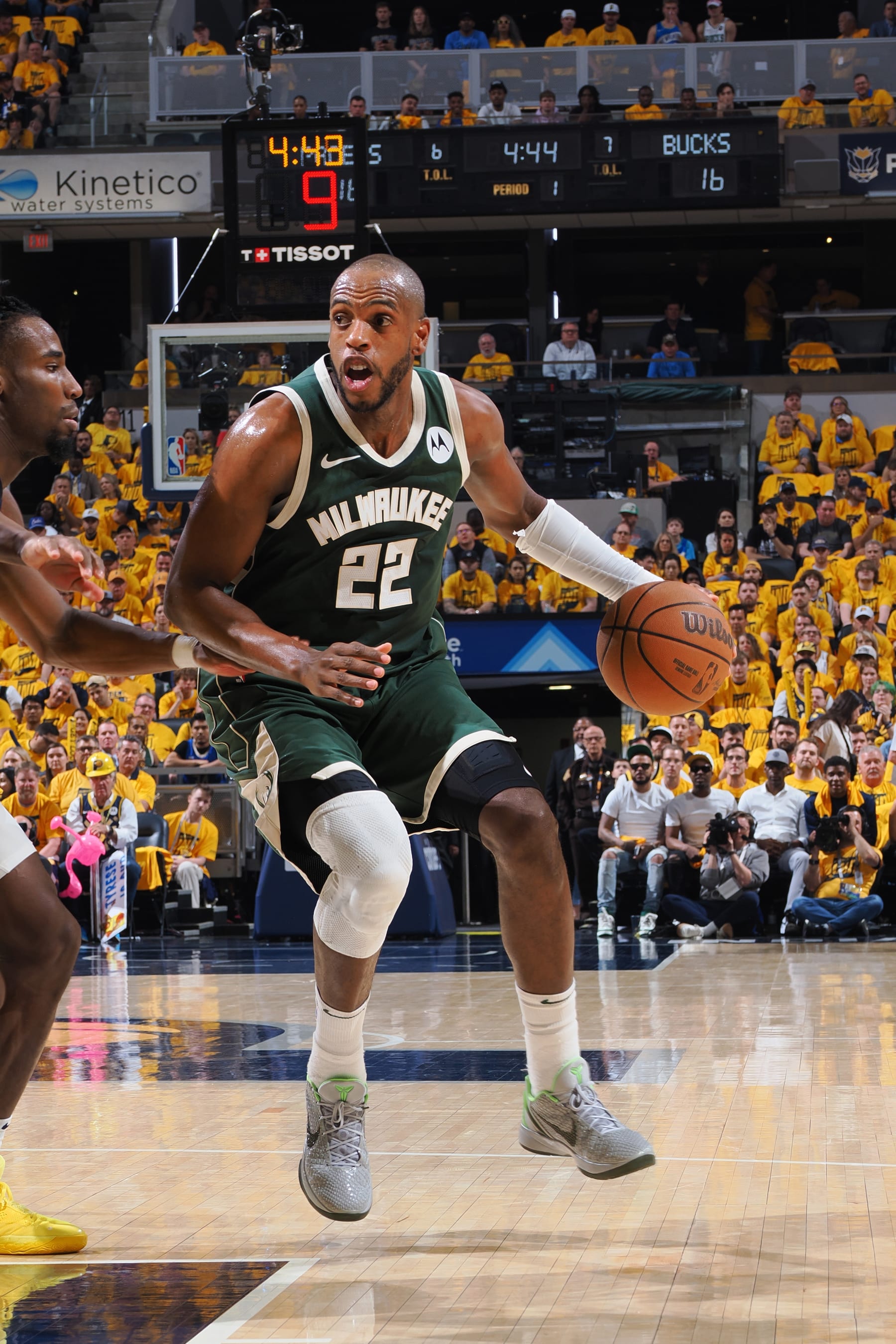 INDIANAPOLIS, IN - MAY 2:  Khris Middleton #22 of the Milwaukee Bucks handles the ball during the game against the Indiana Pacers during Round 1 Game 6 of the 2024 NBA Playoffs on May 2, 2024 at Gainbridge Fieldhouse in Indianapolis, Indiana. NOTE TO USER: User expressly acknowledges and agrees that, by downloading and or using this Photograph, user is consenting to the terms and conditions of the Getty Images License Agreement. Mandatory Copyright Notice: Copyright 2024 NBAE (Photo by Ron Hoskins/NBAE via Getty Images)