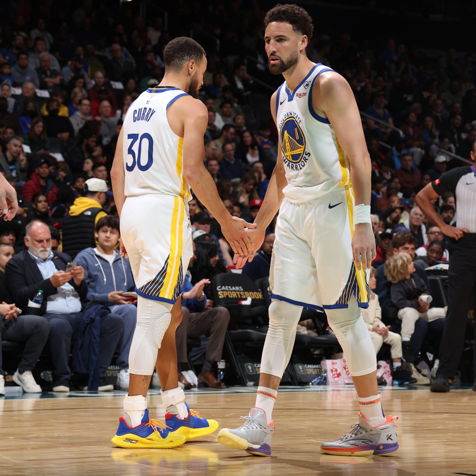 WASHINGTON, DC -  FEBRUARY 27: Klay Thompson #11 of the Golden State Warriors high fives Stephen Curry #30 during the game against the Washington Wizards on February 27, 2024 at Capital One Arena in Washington, DC. NOTE TO USER: User expressly acknowledges and agrees that, by downloading and or using this Photograph, user is consenting to the terms and conditions of the Getty Images License Agreement. Mandatory Copyright Notice: Copyright 2024 NBAE (Photo by Stephen Gosling/NBAE via Getty Images)