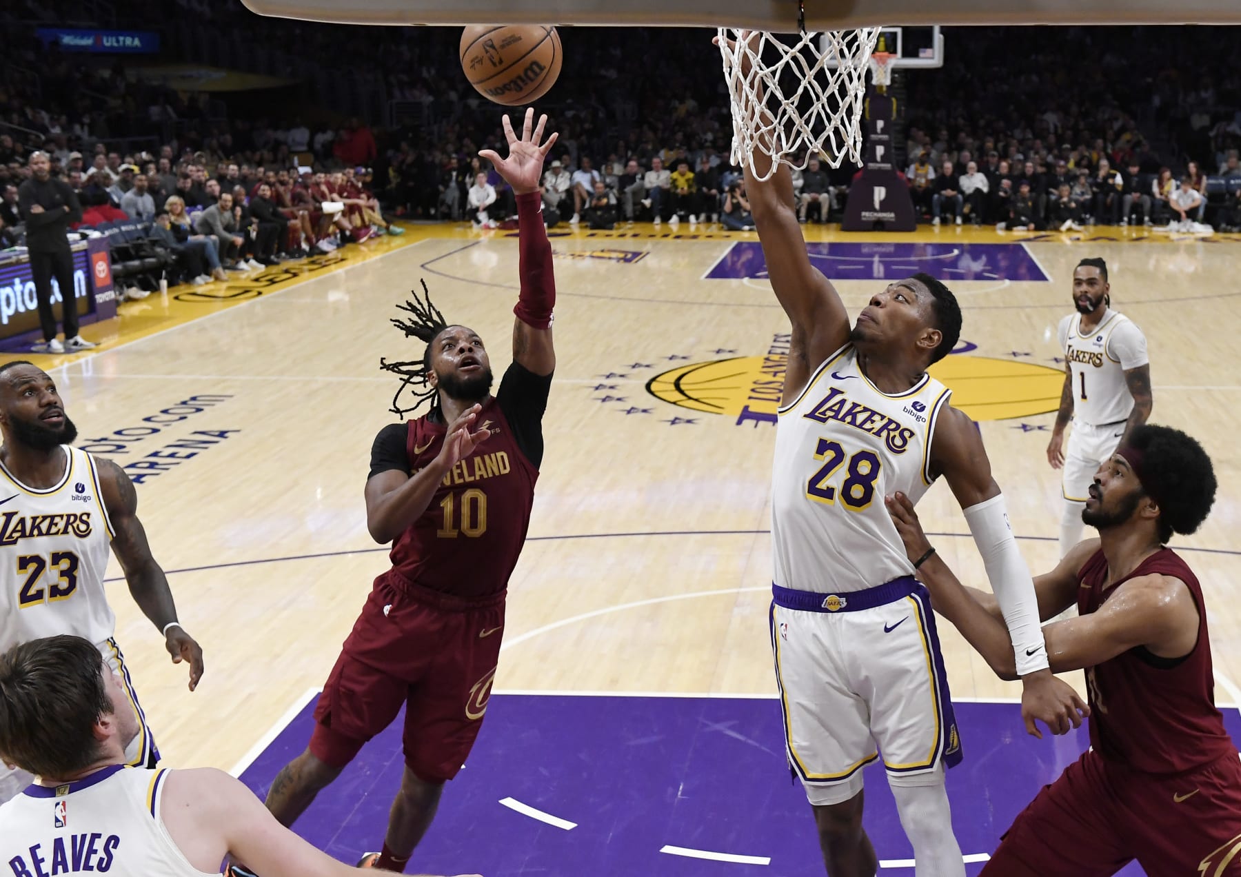 LOS ANGELES, CALIFORNIA - APRIL 6: Darius Garland #10 of the Cleveland Cavaliers scores on floater against Rui Hachimura #28 of the Los Angeles Lakers during the second half at Crypto.com Arena on April 6, 2024 in Los Angeles, California. NOTE TO USER: User expressly acknowledges and agrees that, by downloading and or using this photograph, User is consenting to the terms and conditions of the Getty Images License Agreement. (Photo by Kevork Djansezian/Getty Images)