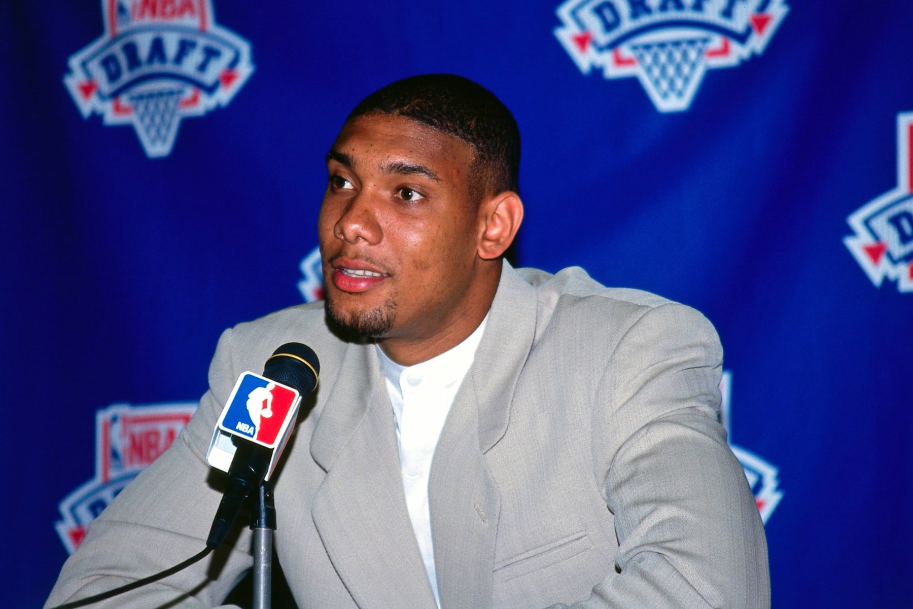 NEW YORK - 1997:  Tim Duncan speaks to the media after being selected by the San Antonio Spurs at the 1997 NBA Draft in New York, New York. NOTE TO USER: User expressly acknowledges that, by downloading and or using this photograph, User is consenting to the terms and conditions of the Getty Images License agreement. Mandatory Copyright Notice: Copyright 1997 NBAE (Photo by NBA Photos/NBAE via Getty Images)
