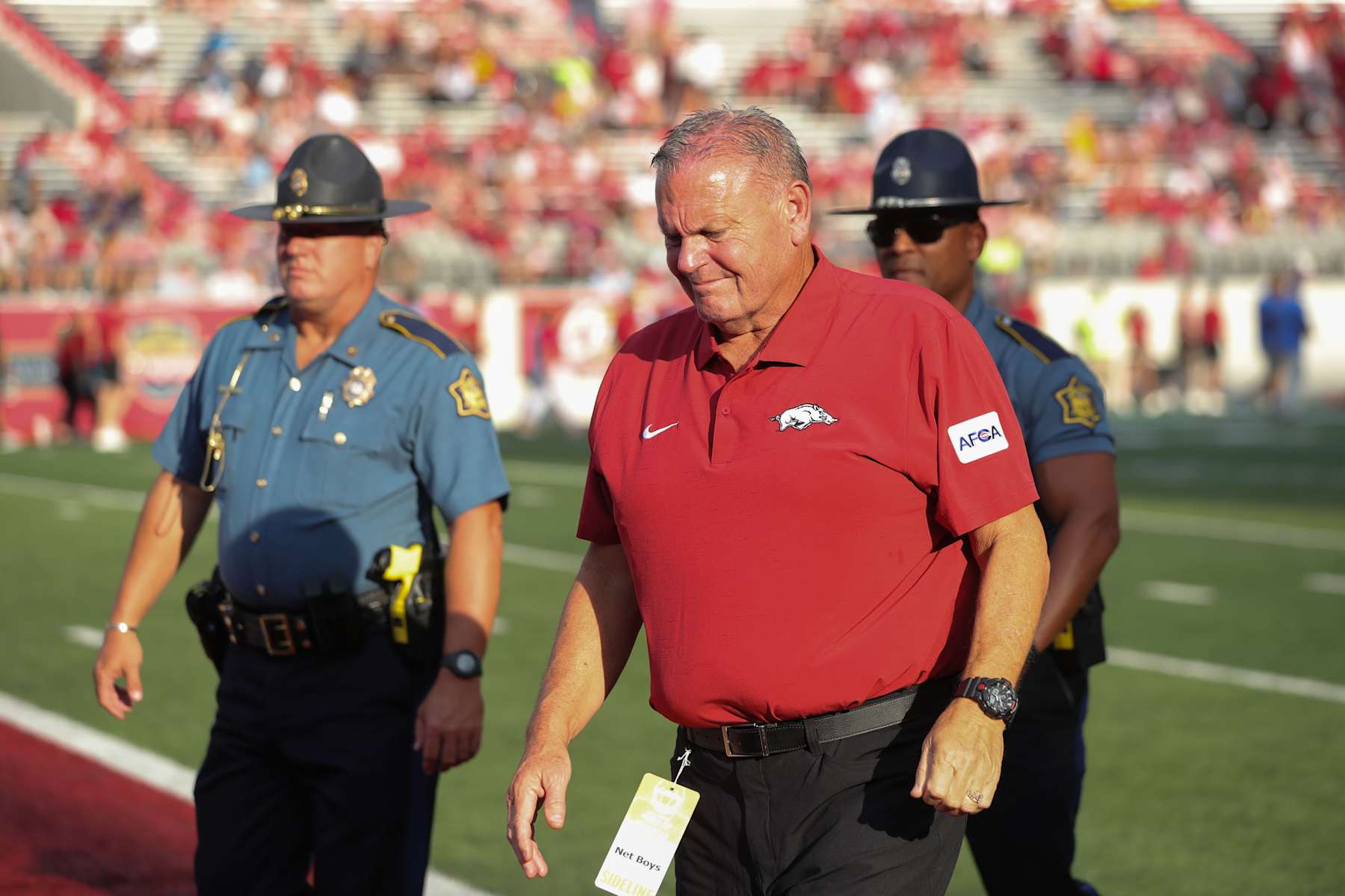 LITTLE ROCK, AR - AUGUST 29: Razorback coach Sam Pittman walks towards the tunnel following the pregame warm up period prior to the game between the Arkansas Razorbacks and the UAPB Golden Lions on August 29, 2024, at War Memorial Stadium in Little Rock, Arkansas. (Photo by John Bunch/Icon Sportswire via Getty Images)