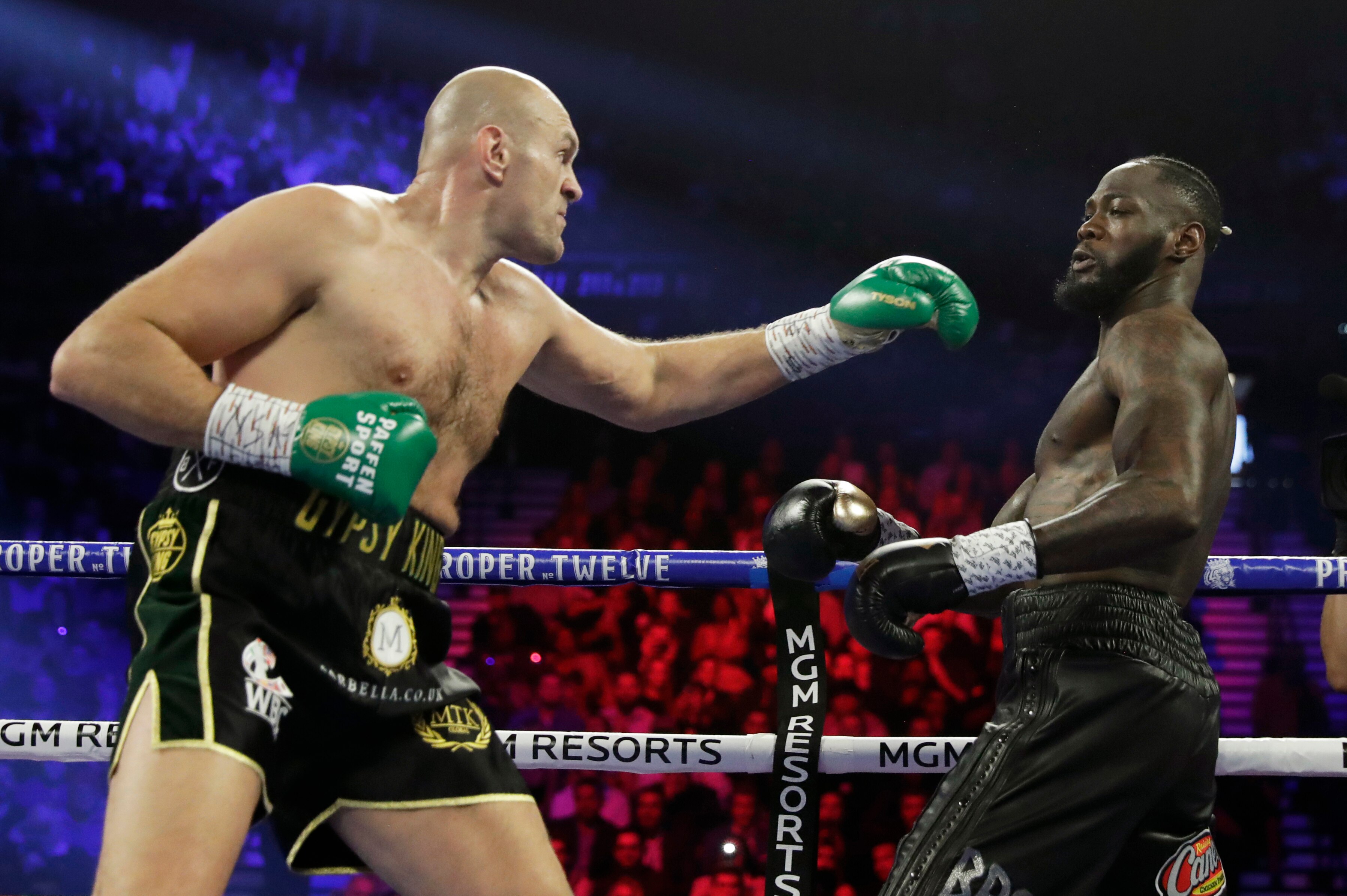 Tyson Fury, left, of England, fight Deontay Wilder during a WBC heavyweight championship boxing match Saturday, Feb. 22, 2020, in Las Vegas. (AP Photo/Isaac Brekken)