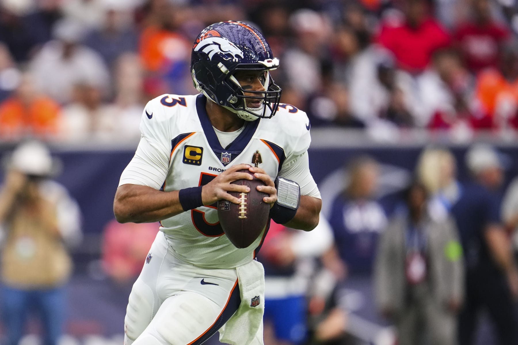 HOUSTON, TX - DECEMBER 03: Russell Wilson #3 of the Denver Broncos drops back to pass during an NFL football game against the Houston Texans at NRG Stadium on December 3, 2023 in Houston, Texas. (Photo by Cooper Neill/Getty Images)