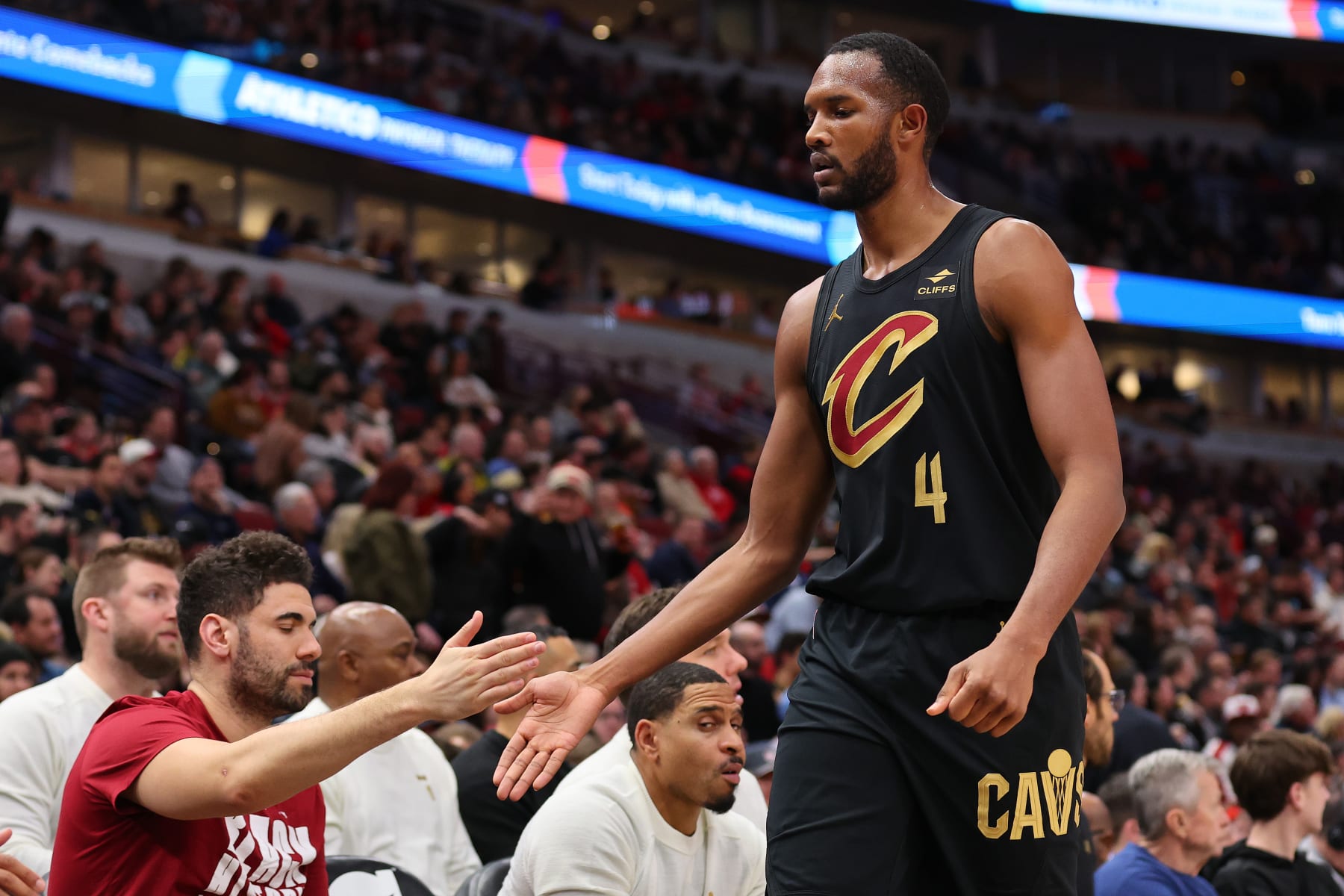 CHICAGO, ILLINOIS - FEBRUARY 28: Evan Mobley #4 of the Cleveland Cavaliers high fives teammates against the Chicago Bulls during the first half at the United Center on February 28, 2024 in Chicago, Illinois. NOTE TO USER: User expressly acknowledges and agrees that, by downloading and or using this photograph, User is consenting to the terms and conditions of the Getty Images License Agreement. (Photo by Michael Reaves/Getty Images)