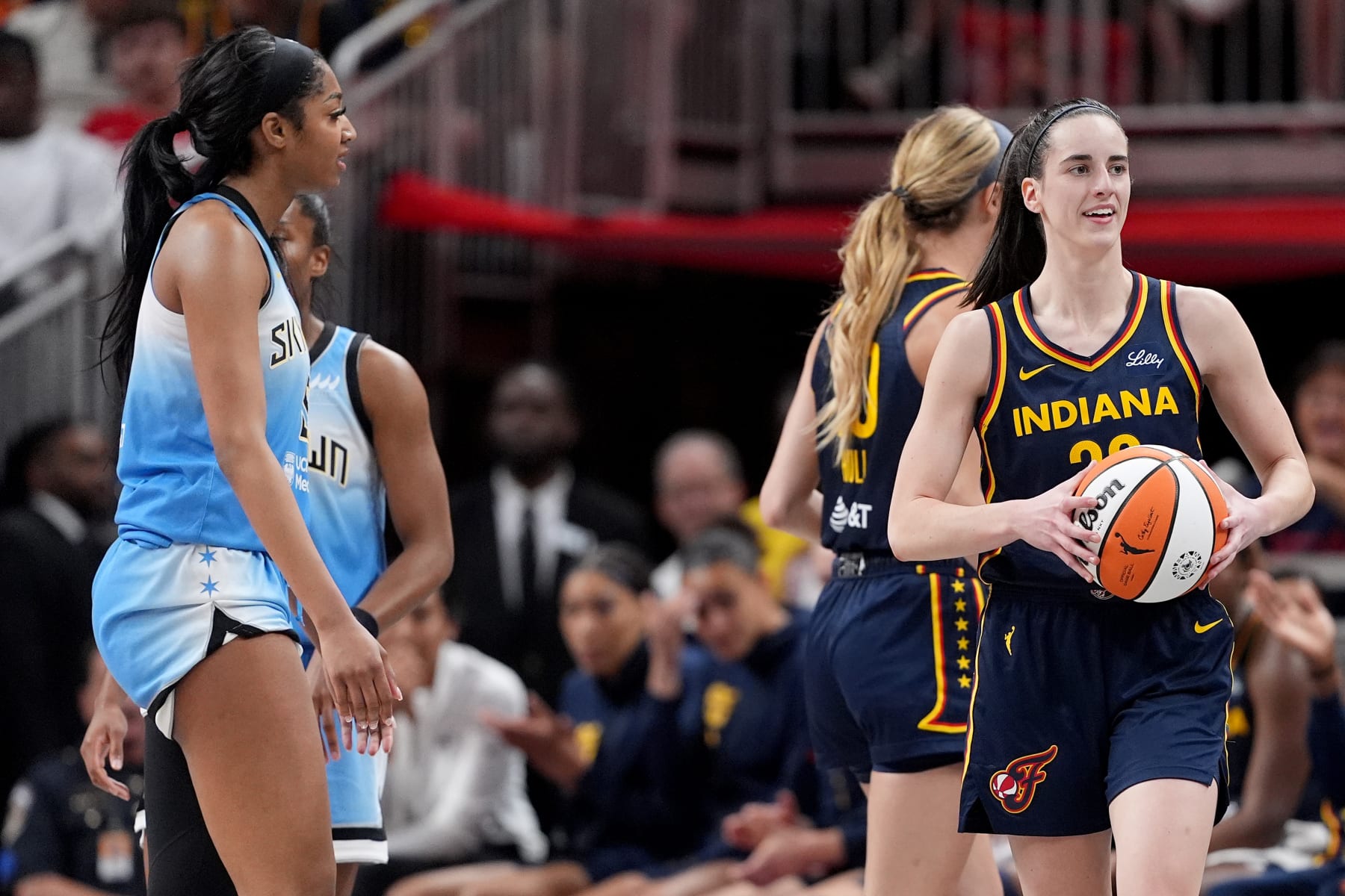 INDIANAPOLIS, INDIANA - JUNE 16: Caitlin Clark #22 of the Indiana Fever reacts after being fouled by Angel Reese #5 of the Chicago Sky during the second half at Gainbridge Fieldhouse on June 16, 2024 in Indianapolis, Indiana. NOTE TO USER: User expressly acknowledges and agrees that, by downloading and or using this photograph, User is consenting to the terms and conditions of the Getty Images License Agreement. (Photo by Emilee Chinn/Getty Images)