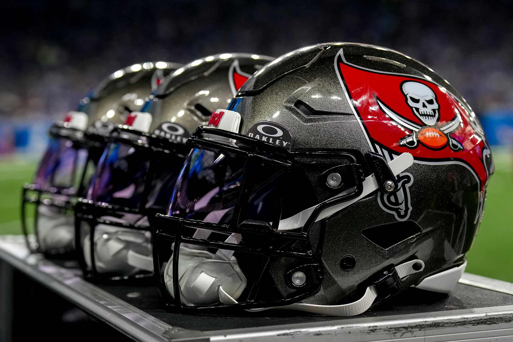 DETROIT, MICHIGAN - SEPTEMBER 15: A detail of the Tampa Bay Buccaneers logo and Oakley logo on a series of football helmets during the game against the Detroit Lions at Ford Field on September 15, 2024 in Detroit, Michigan. (Photo by Nic Antaya/Getty Images)