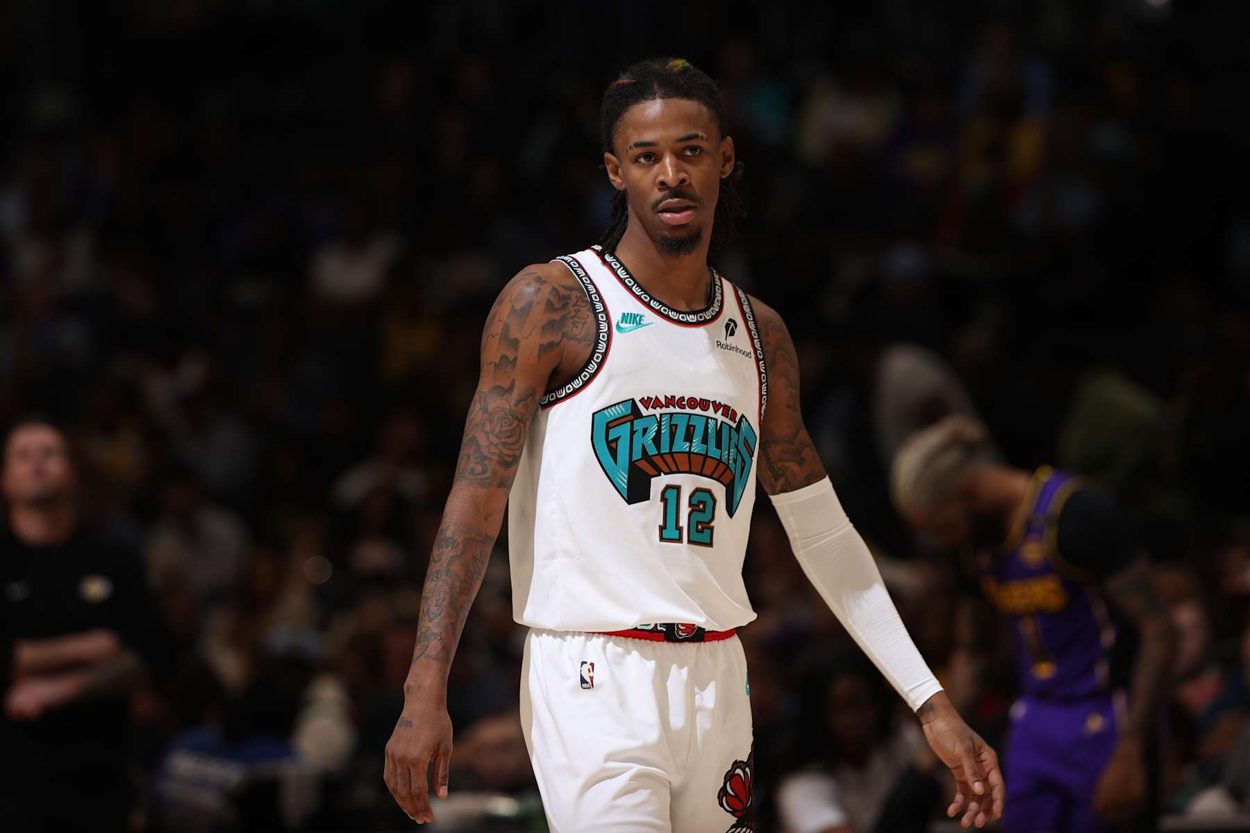 MEMPHIS, TN - NOVEMBER 6: Ja Morant #12 of the Memphis Grizzlies looks on during the game against the Los Angeles Lakers on November 6, 2024 at FedExForum in Memphis, Tennessee. NOTE TO USER: User expressly acknowledges and agrees that, by downloading and or using this photograph, User is consenting to the terms and conditions of the Getty Images License Agreement. Mandatory Copyright Notice: Copyright 2024 NBAE (Photo by Joe Murphy/NBAE via Getty Images)