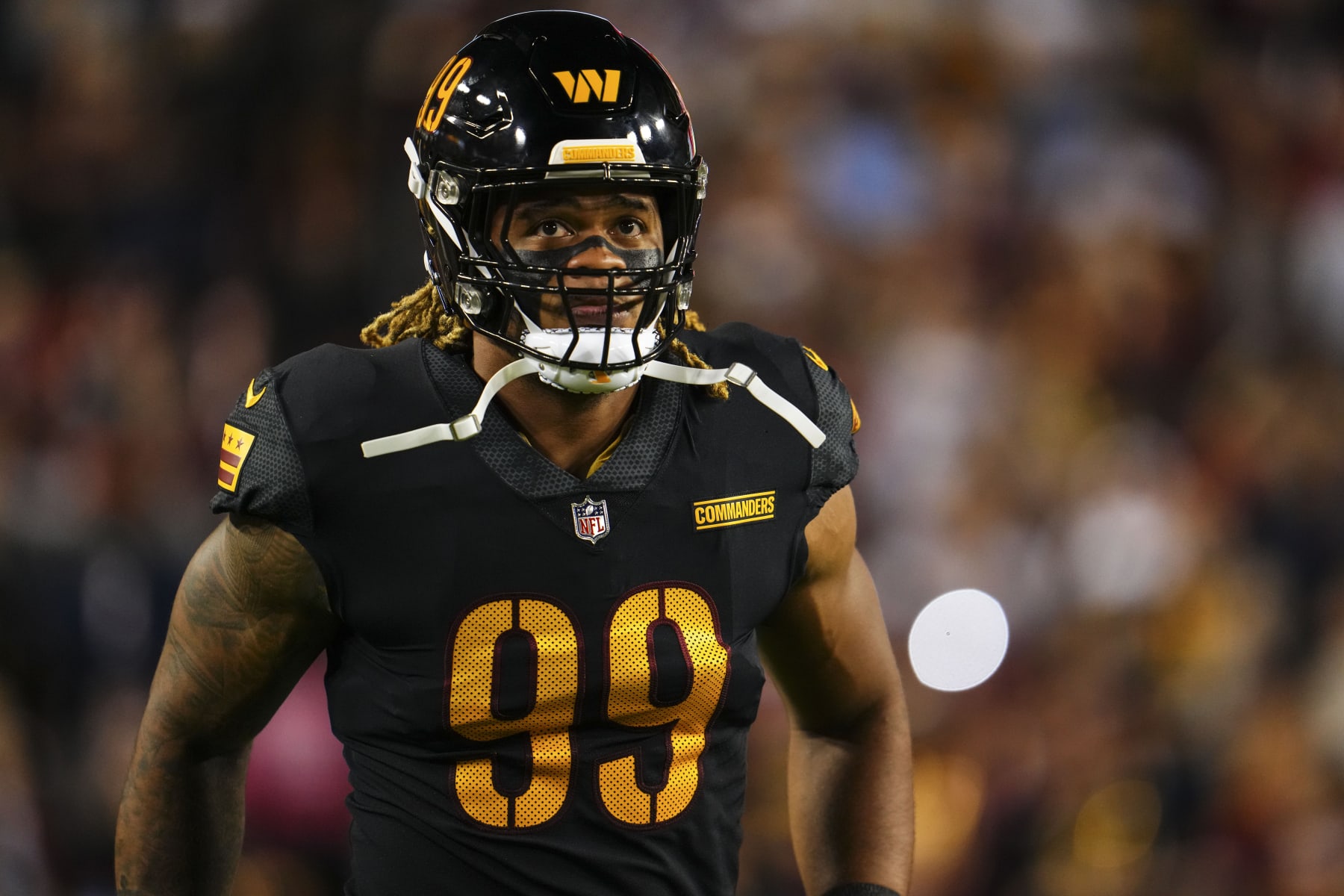 LANDOVER, MD - OCTOBER 05: Chase Young #99 of the Washington Commanders looks on from the field prior to an NFL football game against the Chicago Bears at FedEx Field on October 5, 2023 in Landover, Maryland. (Photo by Cooper Neill/Getty Images)