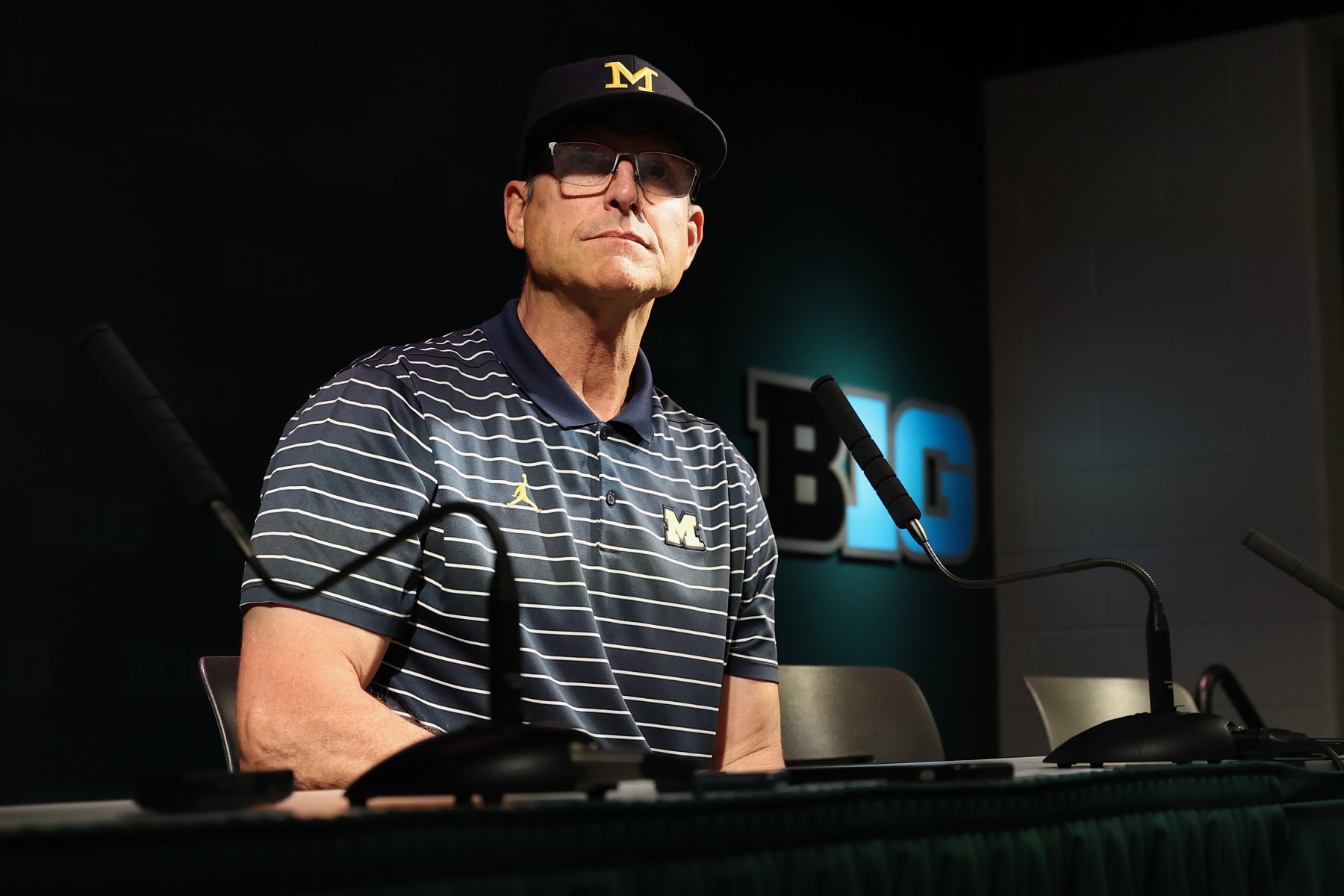 EAST LANSING, MICHIGAN - OCTOBER 21: Head coach Jim Harbaugh of the Michigan Wolverines talks to the media after a 49-0 win over the Michigan State Spartans at Spartan Stadium on October 21, 2023 in East Lansing, Michigan. (Photo by Gregory Shamus/Getty Images)