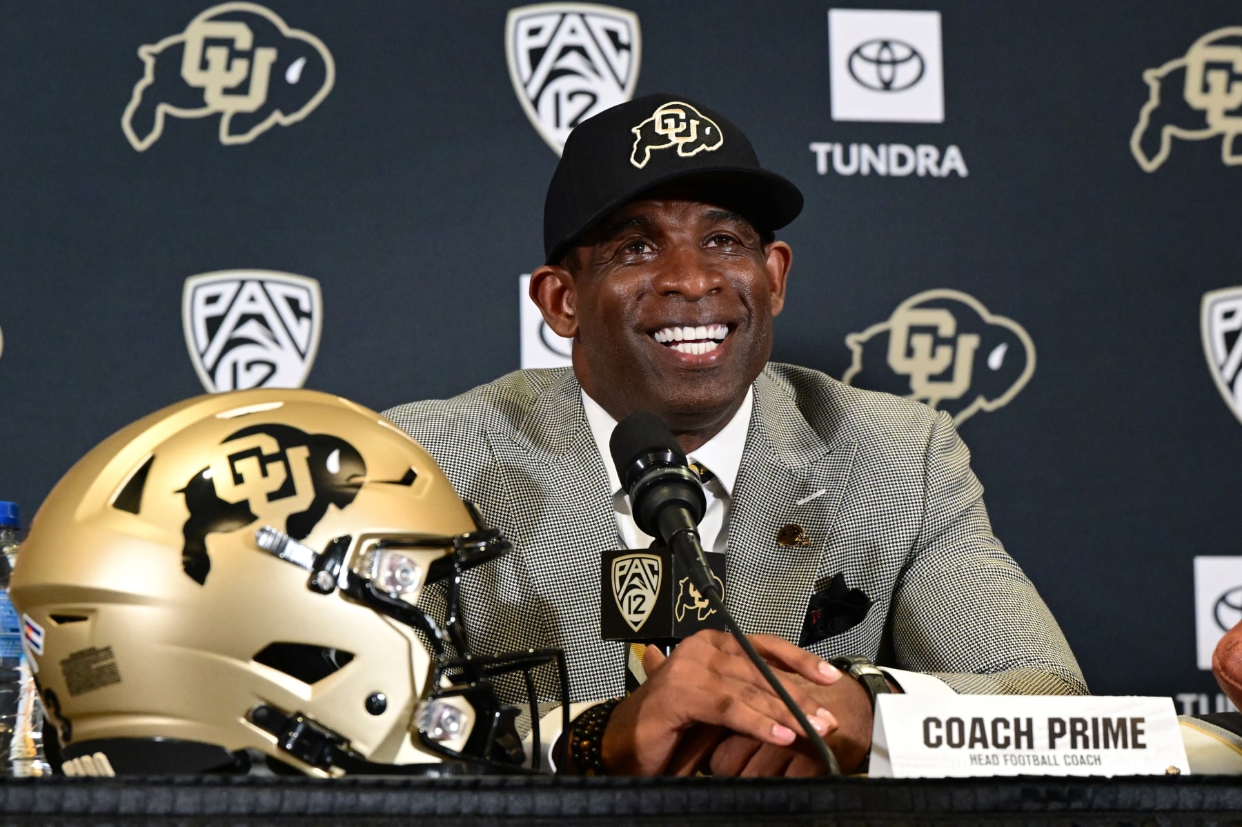 BOULDER, CO - DECEMBER 4:  Deion Sanders, CUs new head football coach, takes questions in the Arrow Touchdown Club during a press conference on December 4, 2022 in Boulder, Colorado. CU held an introductory press conference to announce the hiring of Deion Coach Prime Sanders as the schools new head football coach. Chancellor Phil DiStefano and athletic director Rick George accompanied Sanders into a packed room in the Arrow Touchdown Club inside the Dal Ward Athletic Center. Sanders becomes the 28th head coach in Buffalo football history.  Sanders, who known as Prime Time during his Hall of Fame playing career has since transitioned into Coach Prime as a head football coach. Sanders, 55, joins the CU program from Jackson State University where in three seasons the Tigers compiled a 27-5 record and won back-to-back Southwestern Athletic Conference championships. (Photo by Helen H. Richardson/MediaNews Group/The Denver Post via Getty Images)