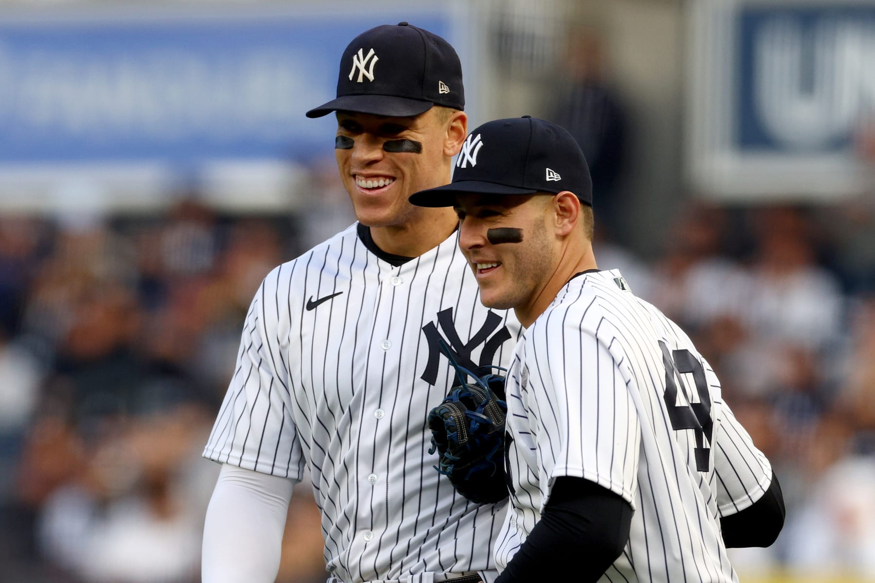 NEW YORK, NEW YORK - OCTOBER 22: Aaron Judge #99 and Anthony Rizzo #48 of the New York Yankees react after the first out was recorded against the Houston Astros during the second inning in game three of the American League Championship Series at Yankee Stadium on October 22, 2022 in New York City. (Photo by Elsa/Getty Images)